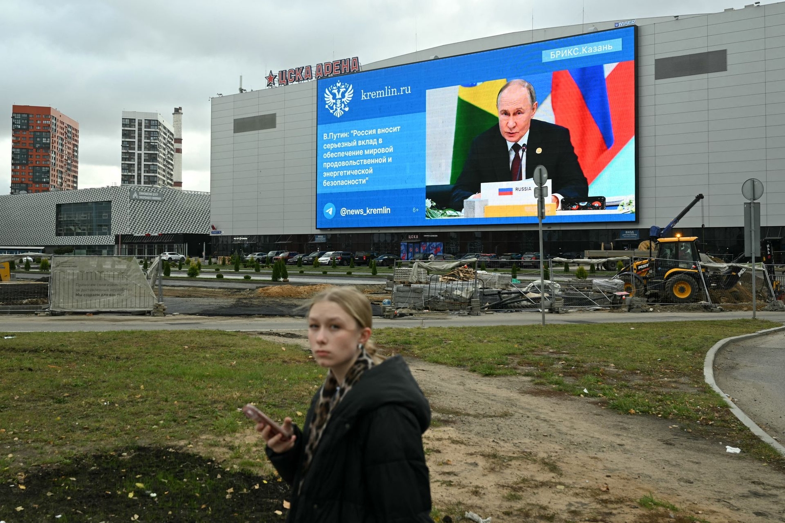 A large screen on the facade of a sports and concert hall in Moscow displays Vladimir Putin delivering a speech in Kazan, Russia, on Oct. 24, 2024