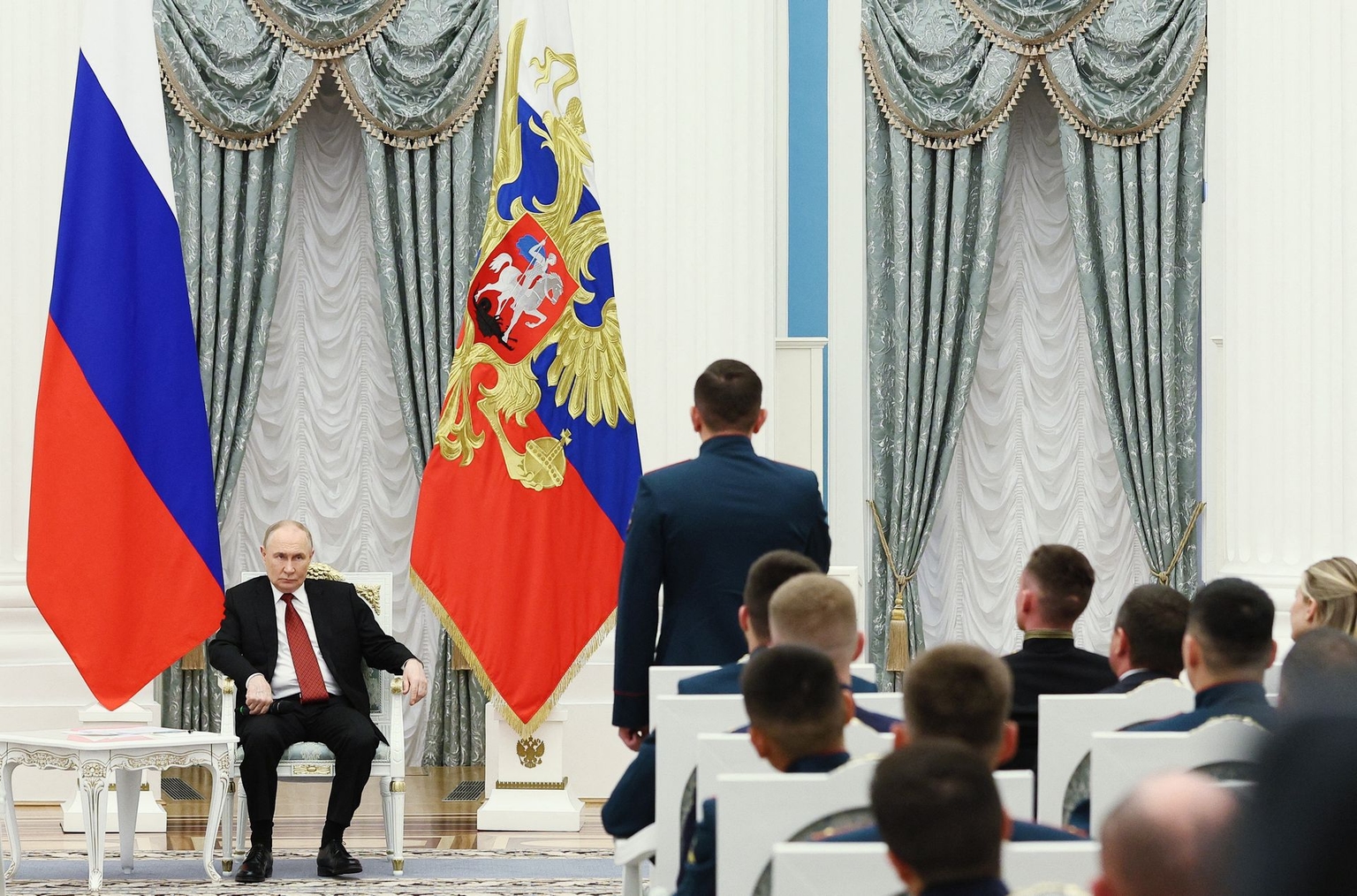 President Vladimir Putin meets with service members as part of the "Time of Heroes" programme, which aims to integrate veterans into high-ranking public positions, at the Kremlin in Moscow, Russia, on June 12, 2025.