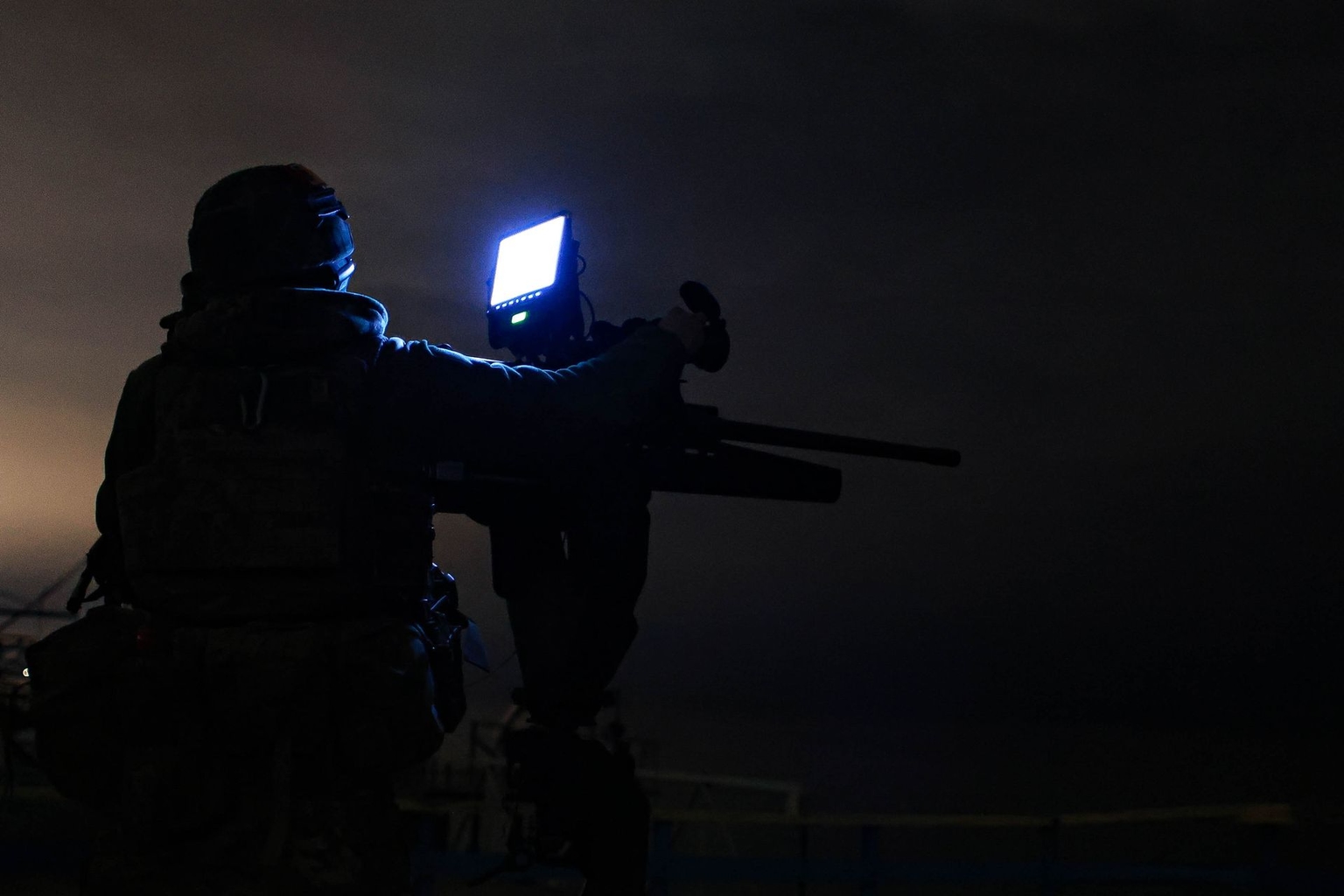 A soldier from a mobile unit of the Tsunami Regiment of the Liut Brigade of Ukraine's National Police uses an M2 Browning machine gun to shoot down Russian drones in Odesa Oblast, Ukraine, on Dec. 22, 2025.