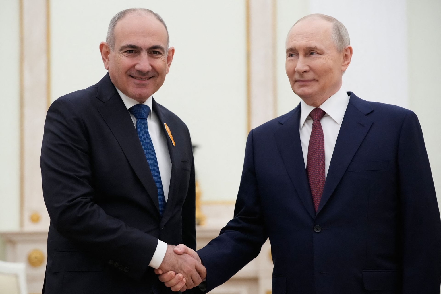 Russian President Vladimir Putin (R) greets Armenian Prime Minister Nikol Pashinyan (L) in Moscow, Russia, on April 1, 2026.
