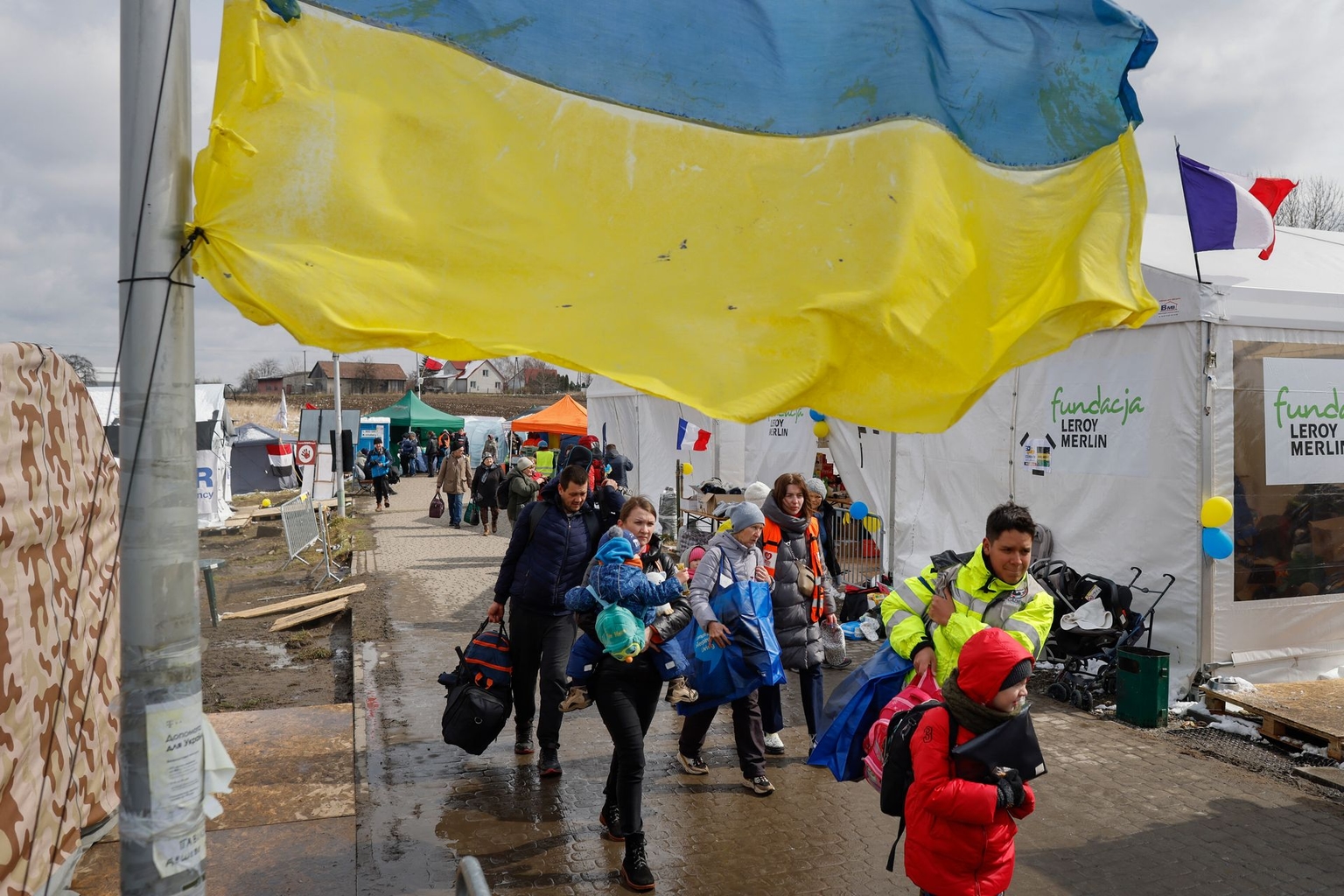 Ukrainian refugees arrive at the Medyka border crossing in Poland on April 3, 2022