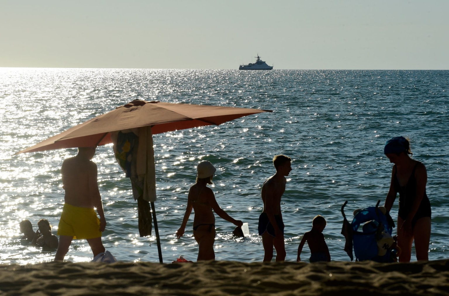 People on a Black Sea beach in Sevastopol, Crimea, Ukraine, on July 15, 2022.