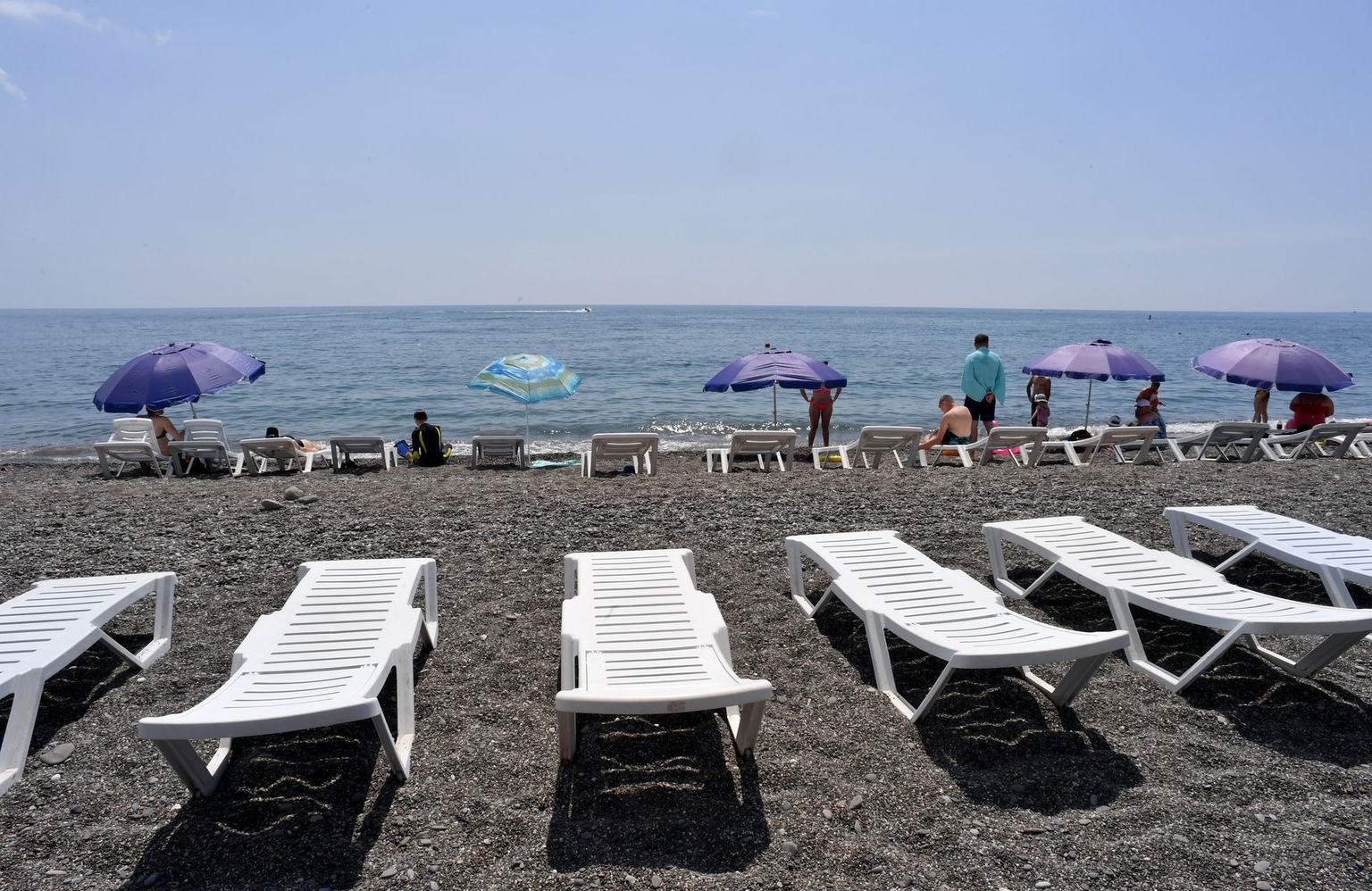 People relax on a Black Sea beach in the resort town of Alushta, Russia-occupied Crimea, Ukraine, on June 18, 2023.