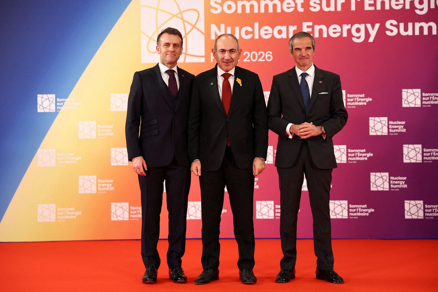 French President Emmanuel Macron (L), IAEA Director General Rafael Grossi (C), and Armenian Prime Minister Nikol Pashinyan (R) in France on March 10, 2026