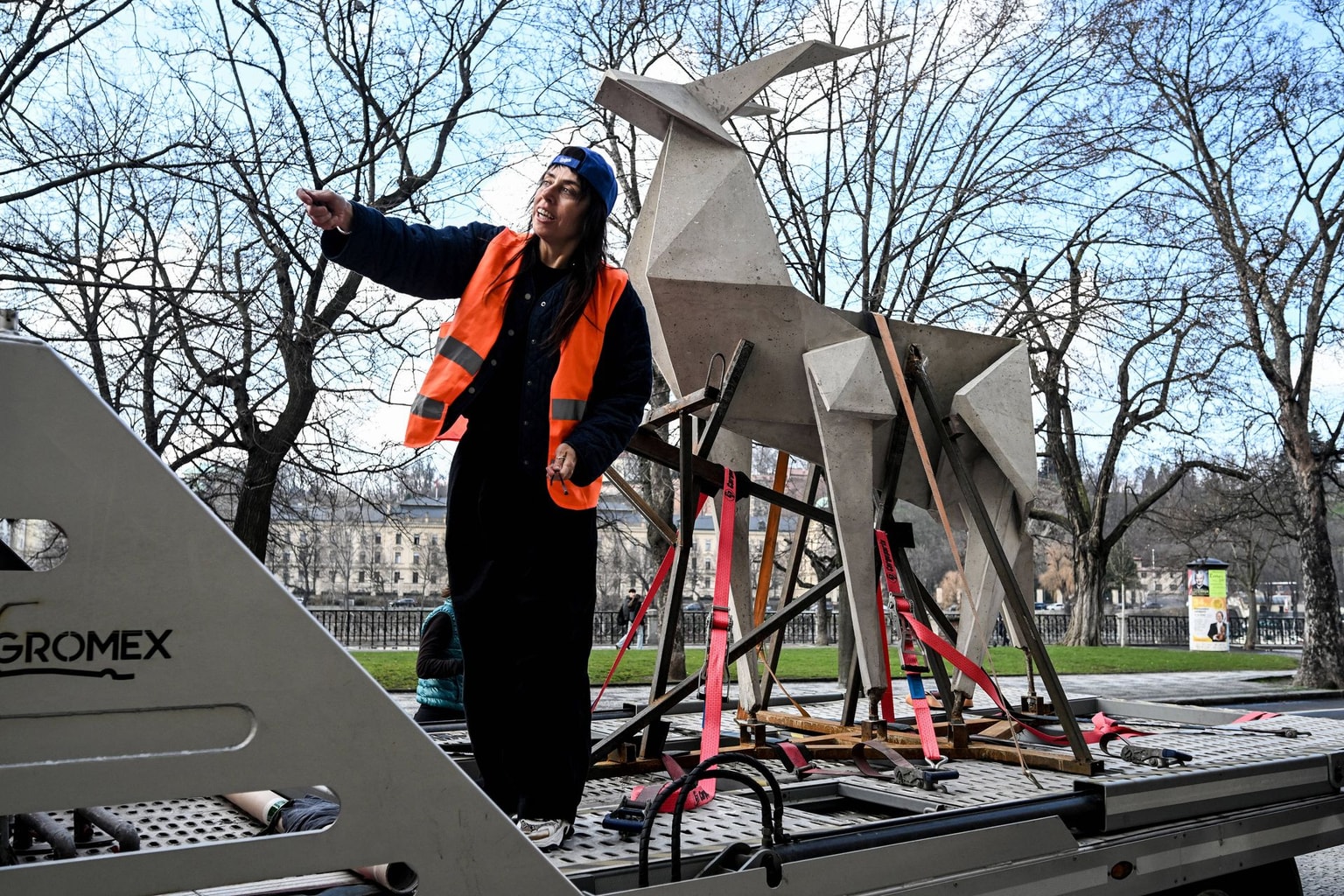 Zhanna Kadyrova stands next to her "Origami Deer" sculpture in Prague, Czech Republic, on March 12, 2026