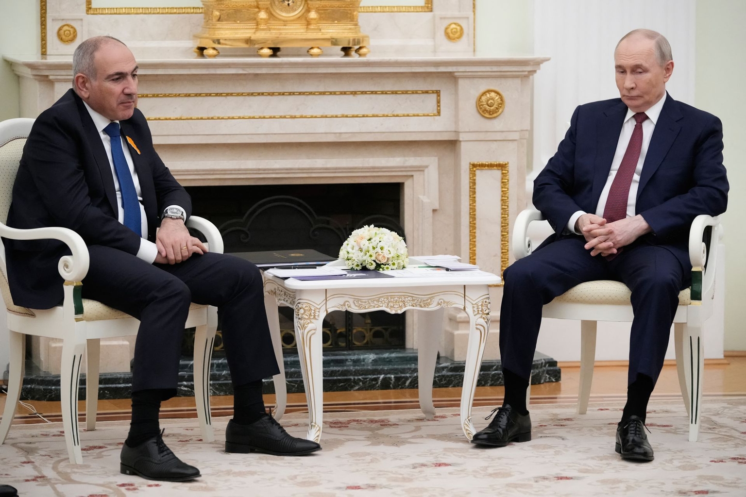 Putin (R) speaks with Armenian Prime Minister Nikol Pashinyan (L) during their meeting at the Kremlin in Moscow, Russia, on April 1, 2026.