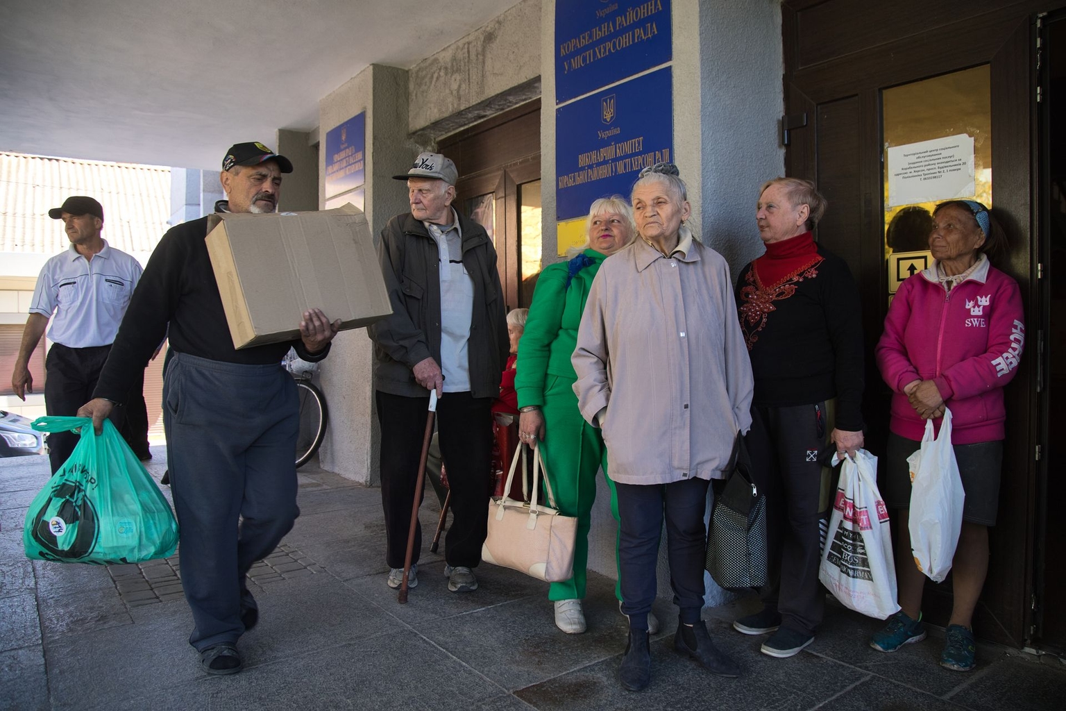 Elderly residents wait to receive meals from World Central Kitchen in Kherson, Ukraine, on May 5, 2026.