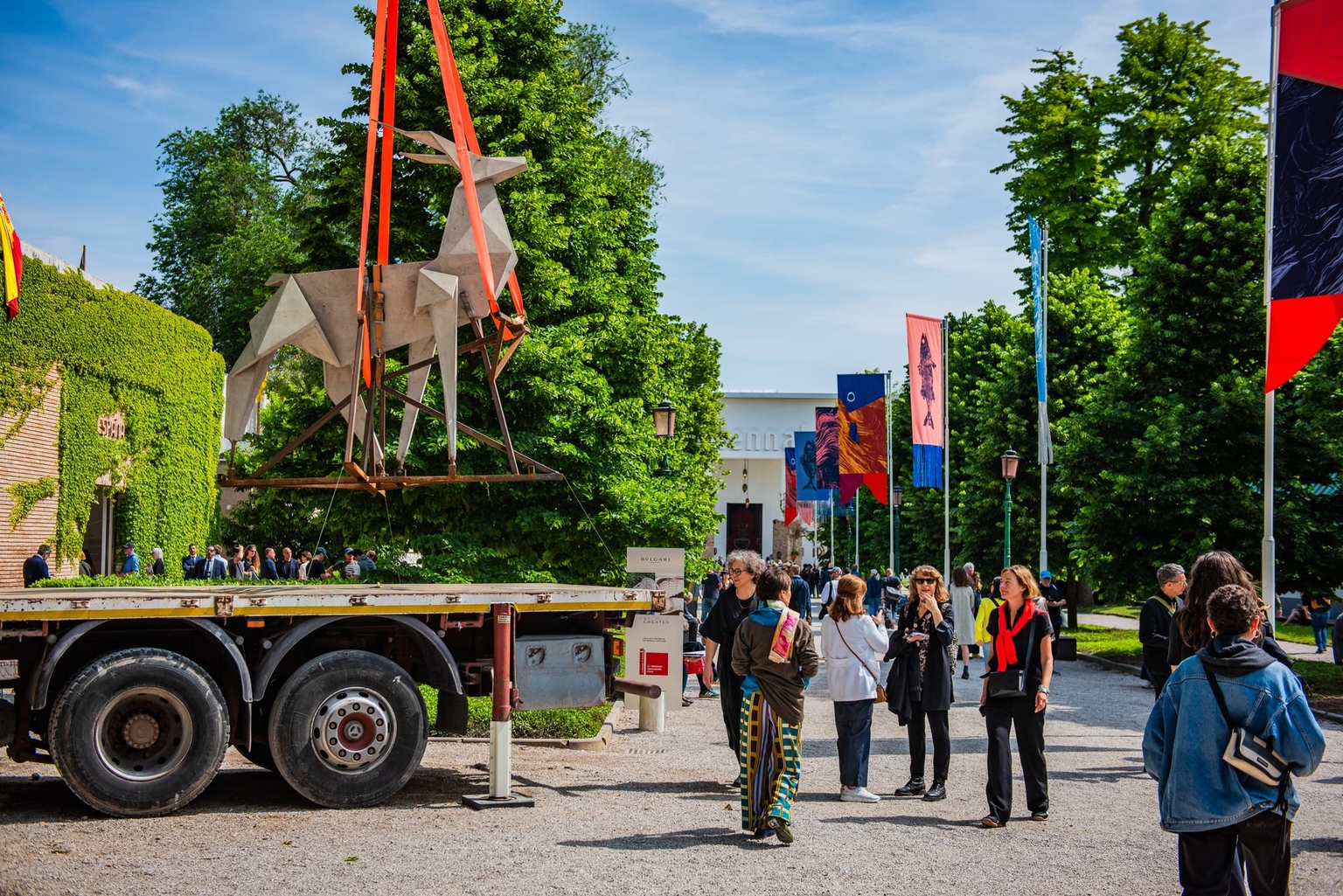Zhanna Kadyrova's "Origami Deer" sculpture suspended from a crane at the Arsenale during a press preview for the 61st Venice Biennale in Venice, Italy, on May 8, 2026.
