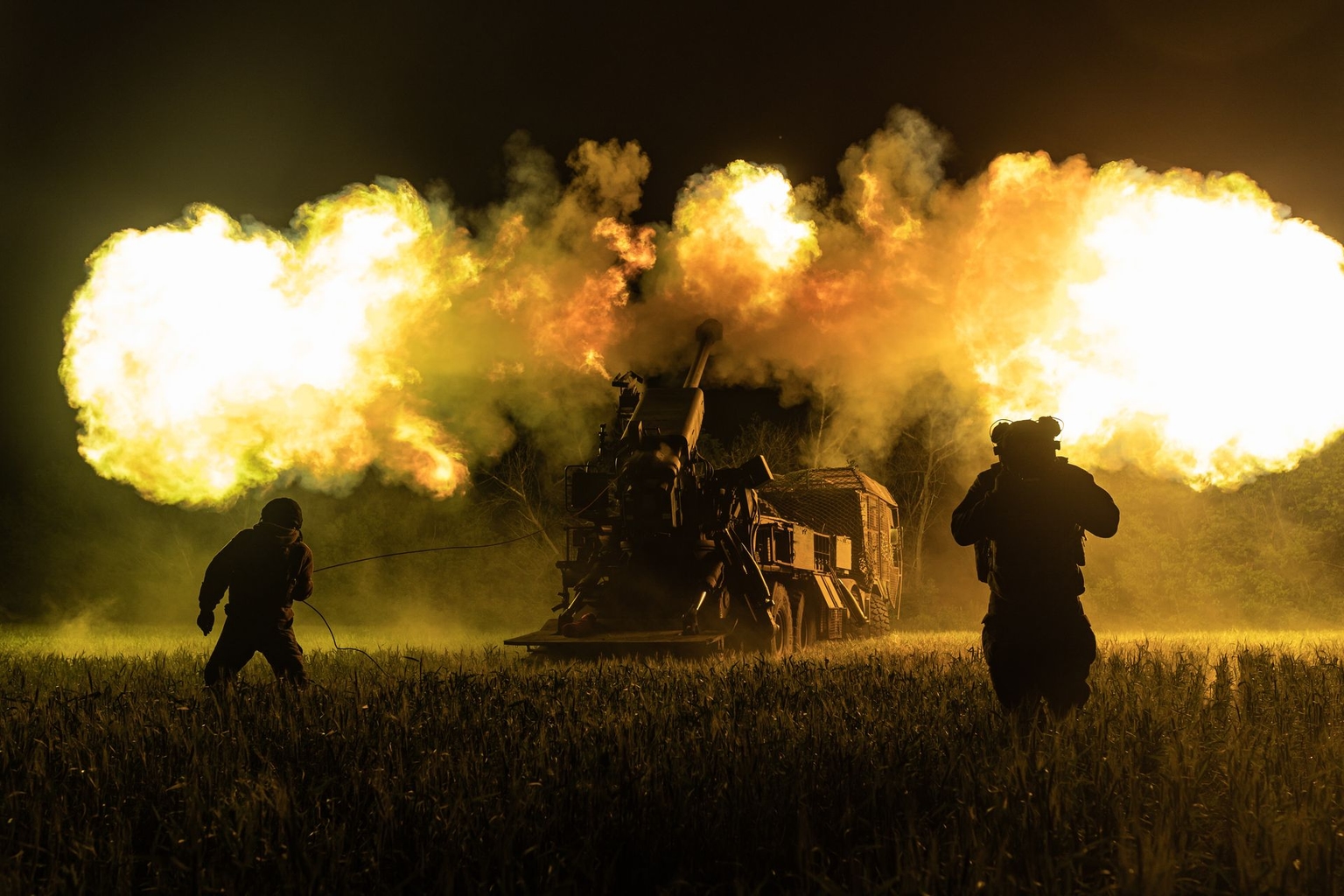 Ukrainian soldiers from the 30th Brigade fire a Bohdana self-propelled howitzer at Russian positions in Donetsk Oblast, Ukraine, on May 31, 2026.