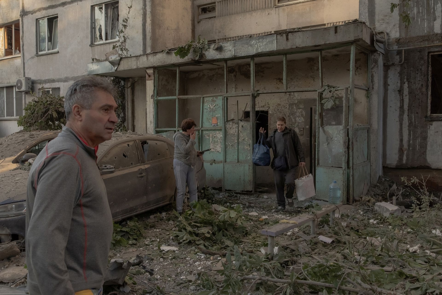 Residents gather outside a damaged residential building following Russian missile and drone strikes in Kyiv, Ukraine, on June 2, 2026.