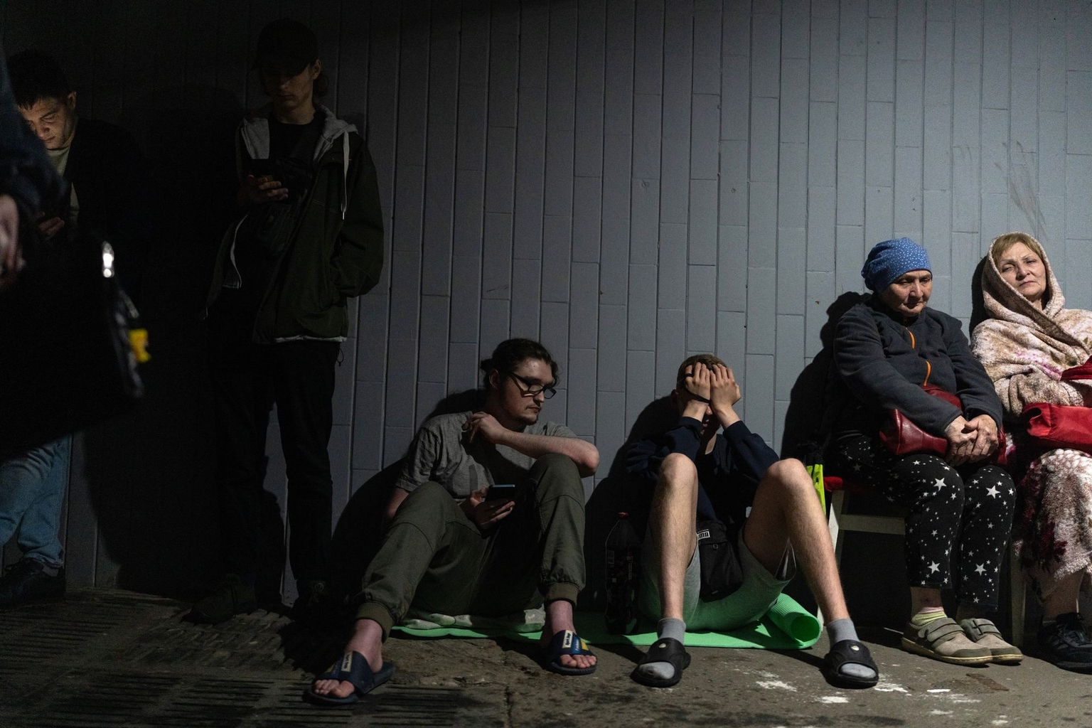 Residents gather outside a damaged residential building following a Russian missile strike in Kyiv, Ukraine, on June 15, 2026.