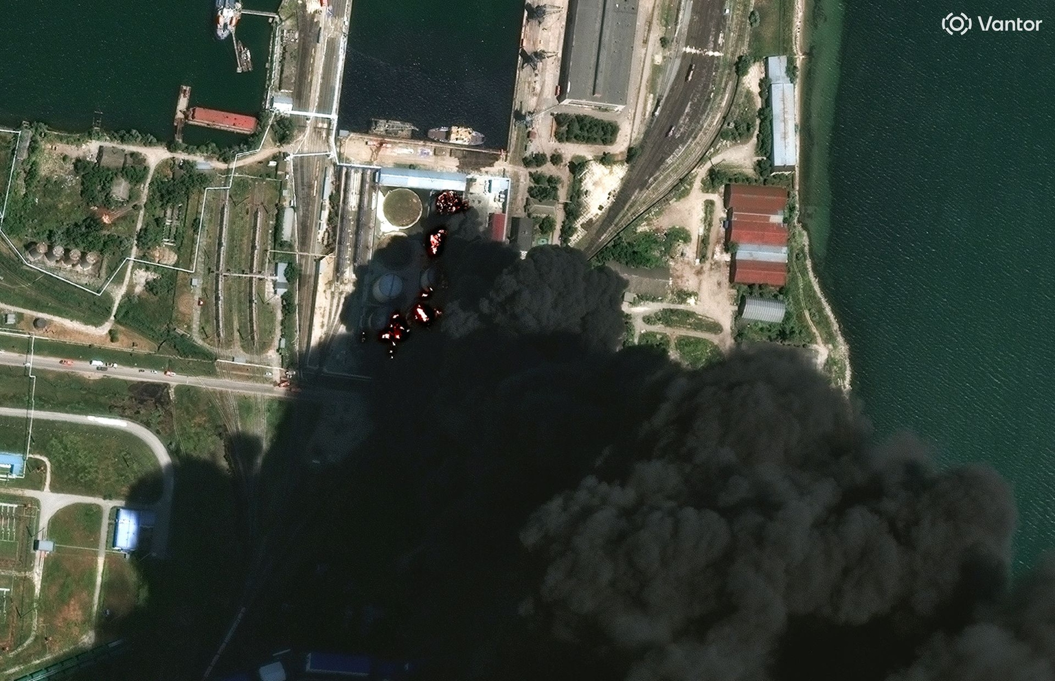 A satellite image shows burning storage tanks and heavy smoke following attacks in Kerch, Russia-occupied Crimea, Ukraine, on June 20, 2026.