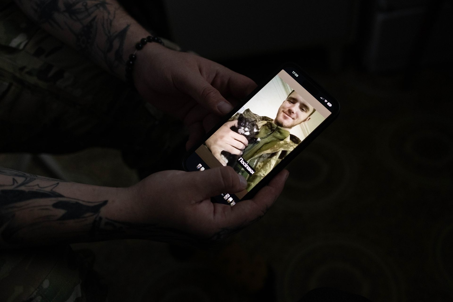 Viacheslav Pylypenko and kitten Misa in a photo from the frontline, shown in Kyiv, Ukraine, on Sept. 28, 2025.
