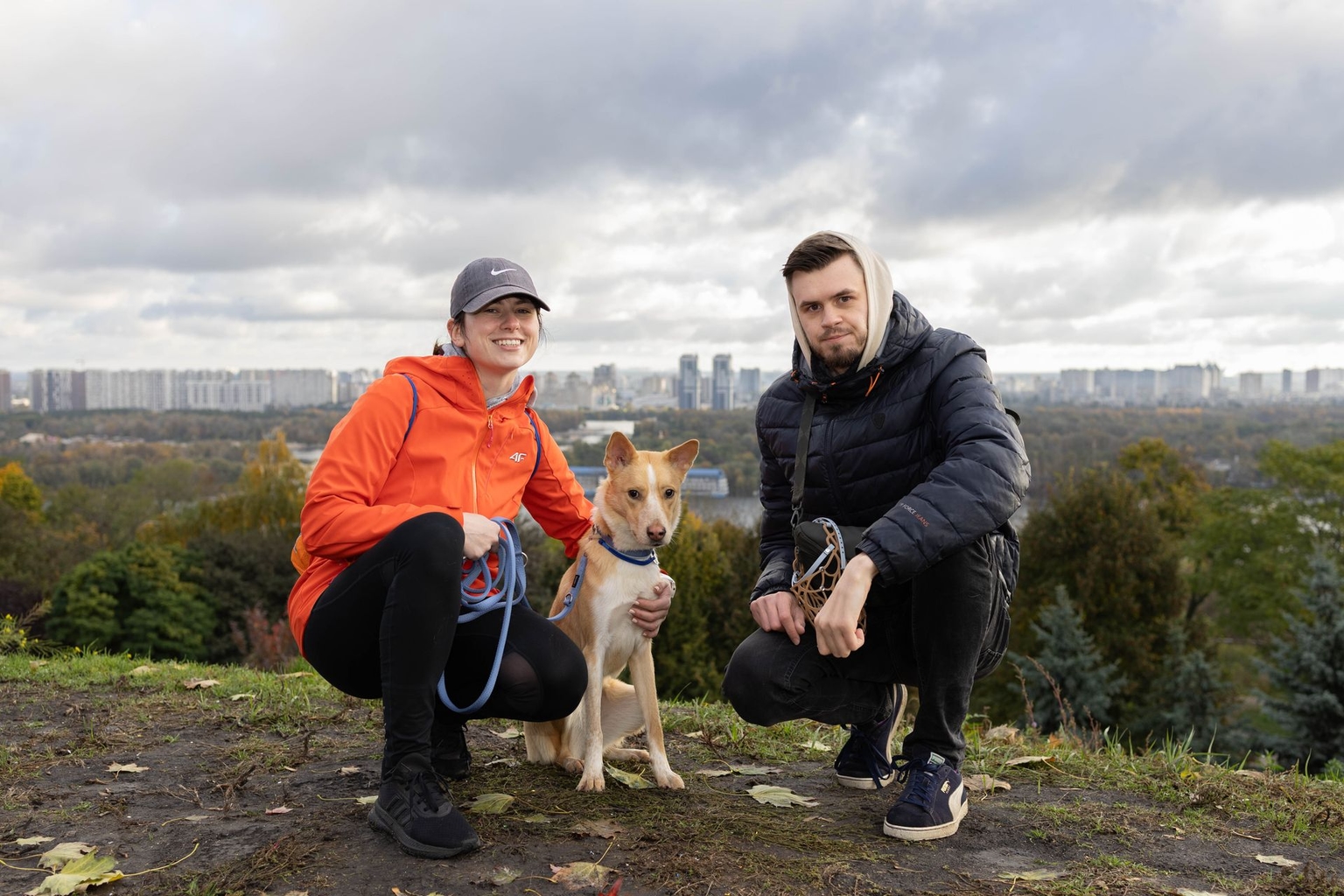 Kateryna Hodunova and Andrii Boiko with their rescued dog Fasolia from Pokrovsk, Donetsk Oblast, in Kyiv, Ukraine, on Oct. 12, 2025.