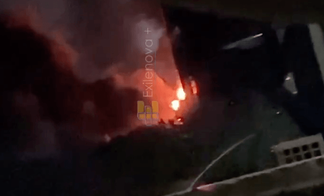 Smoke rises from a fire burning in the distance