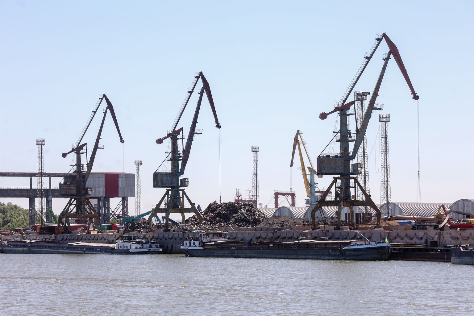 Barges are loaded with grain at the Reni river port on the Danube River in Odesa Oblast, Ukraine, on July 21, 2022.