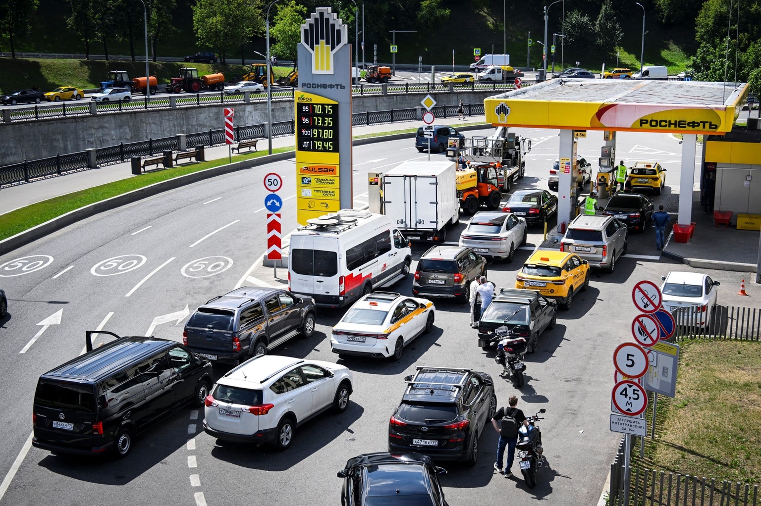 People queue to refuel their cars at a Rosneft gas station in Moscow, Russia, on June 30, 2026.