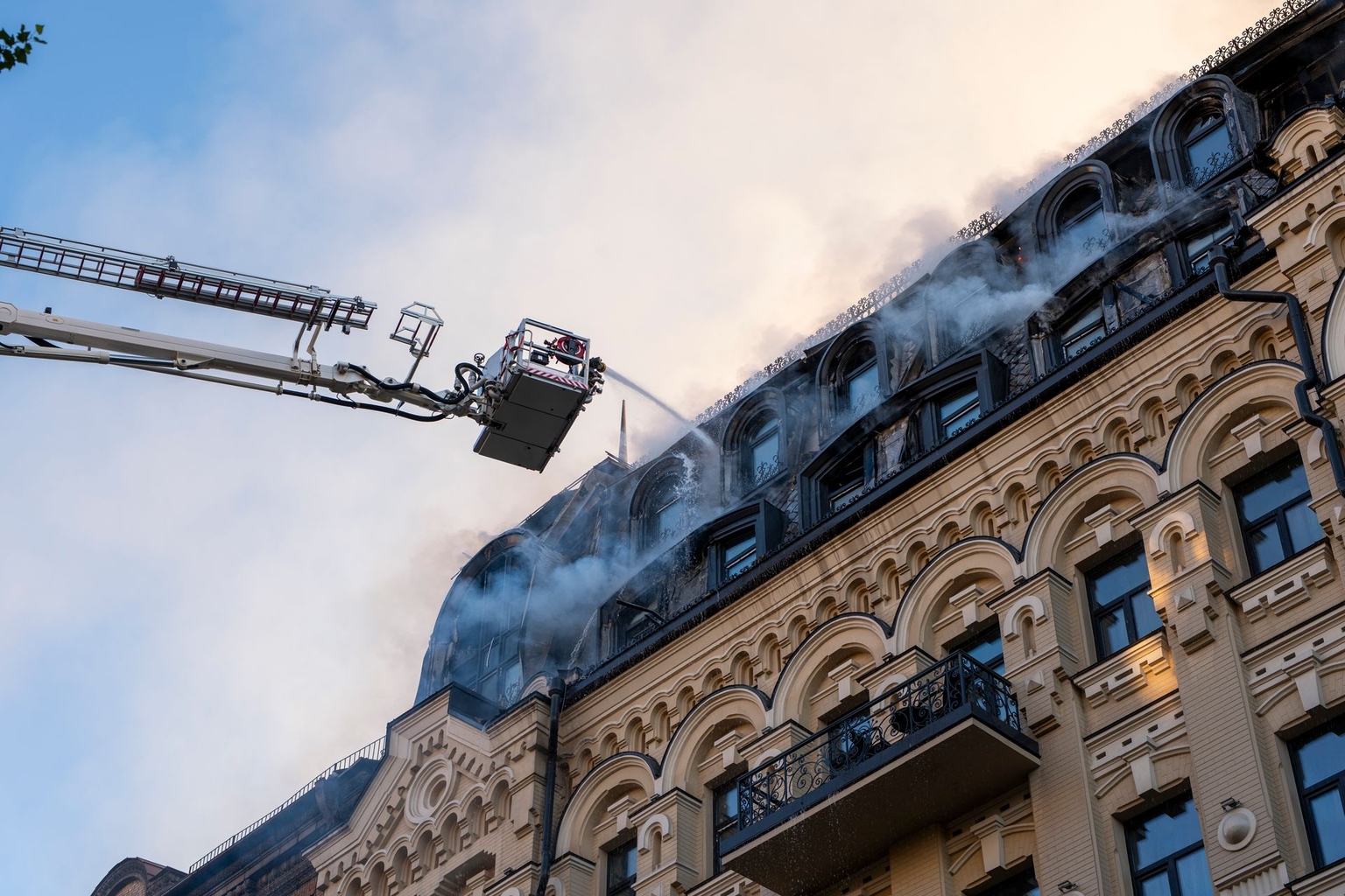 Firefighters extinguish a fire in a building damaged by a Russian attack in Kyiv, Ukraine, on July 2, 2026.