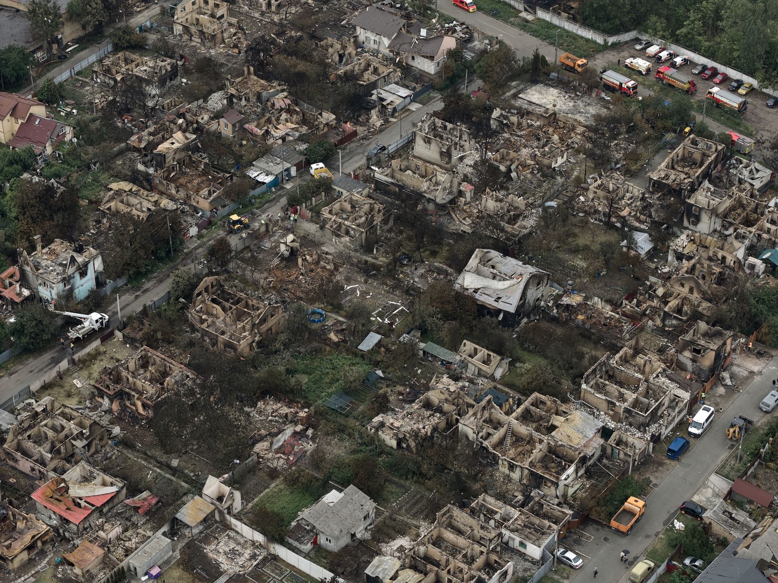 An aerial view shows the scale of destruction in Vyshneve, Kyiv Oblast, Ukraine, following a Russian night attack on July 6, 2026, with burnt-out houses and damaged streets visible across the area.