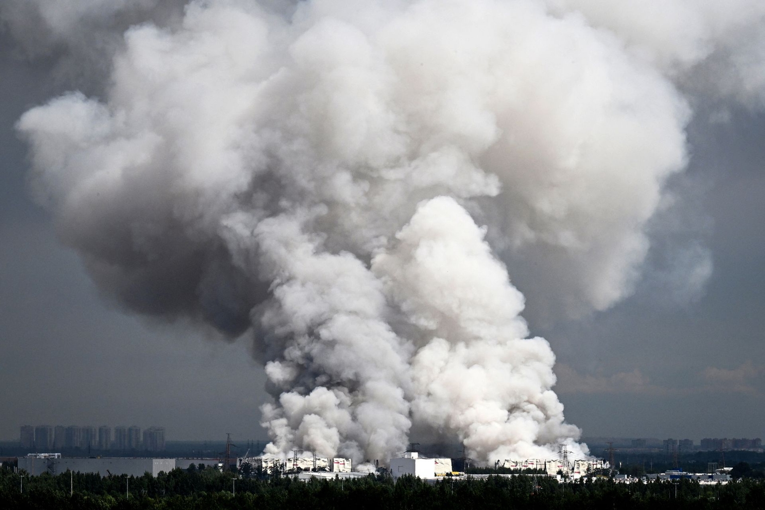Smoke rises from a warehouse belonging to Russian e-commerce giant Wildberries near St. Petersburg, Russia, after being hit by Ukrainian drones, on July 24, 2026.