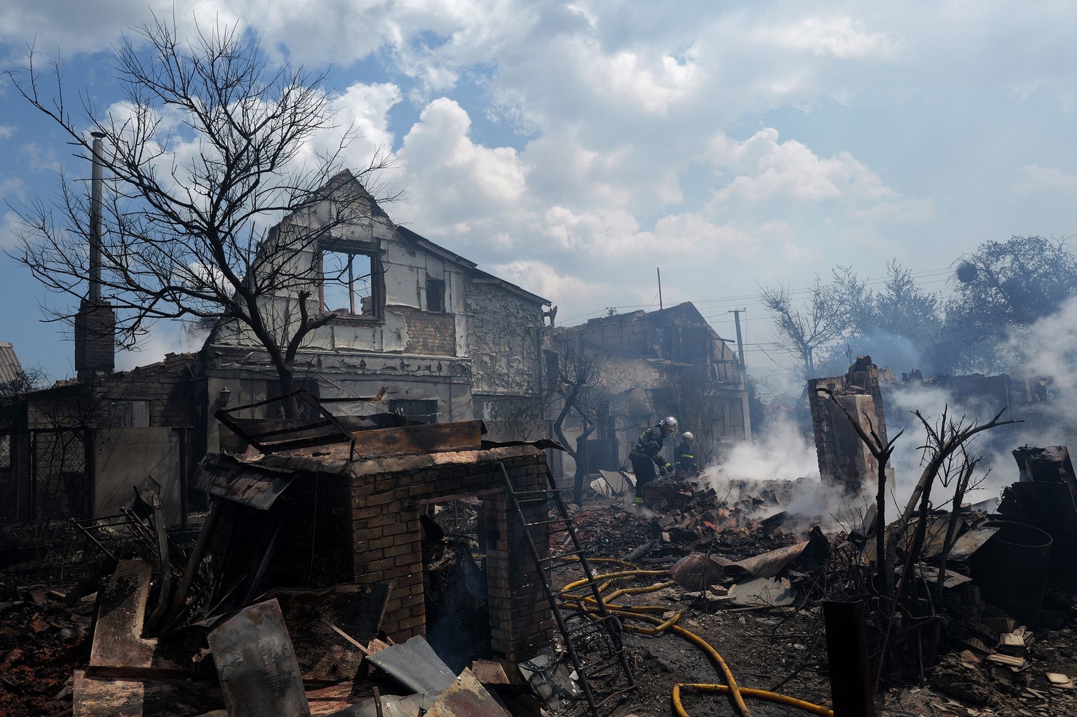 Firefighters work amid the smoking rubble of destroyed residential buildings following the Russian attack on Vyshneve, Kyiv Oblast, Ukraine, on July 6, 2026.