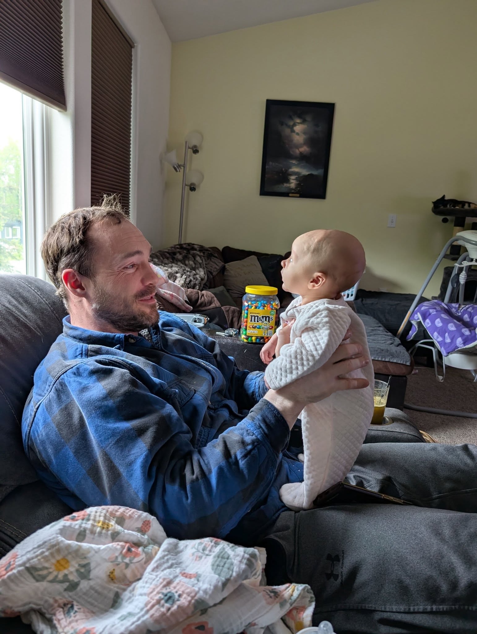 Shane Tackett plays with his daughter Iris.