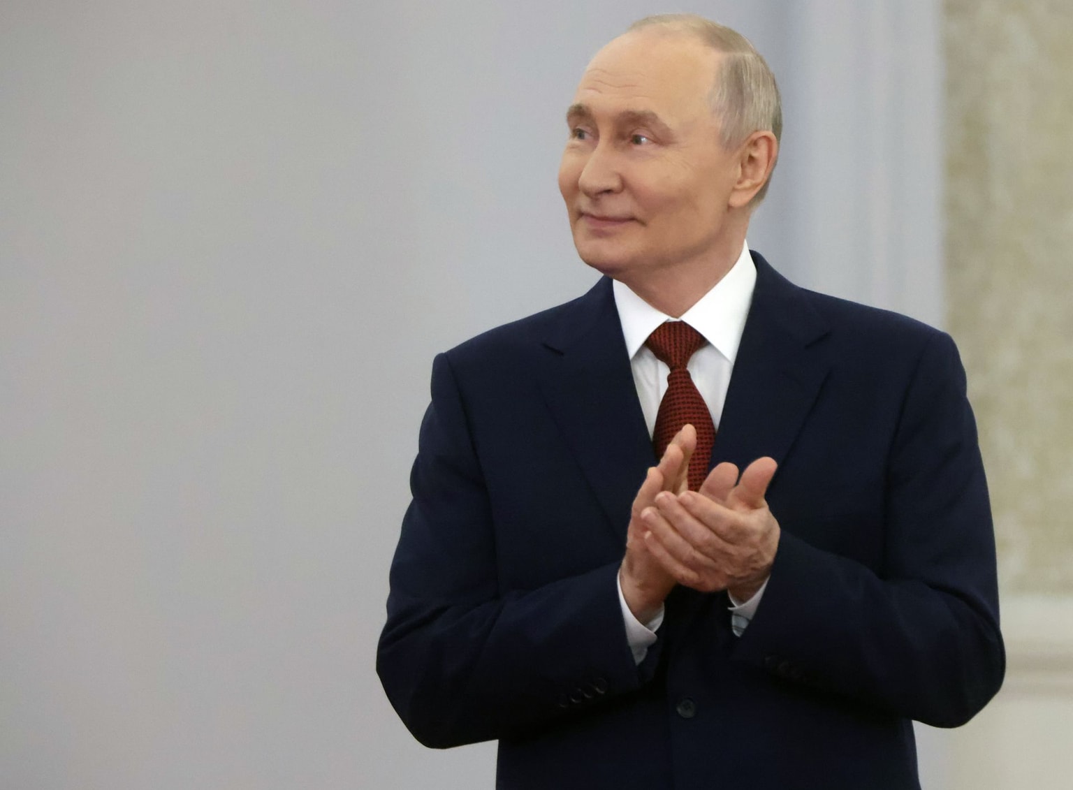 Russian President Vladimir Putin applauds in Moscow, Russia, on July 27, 2026.