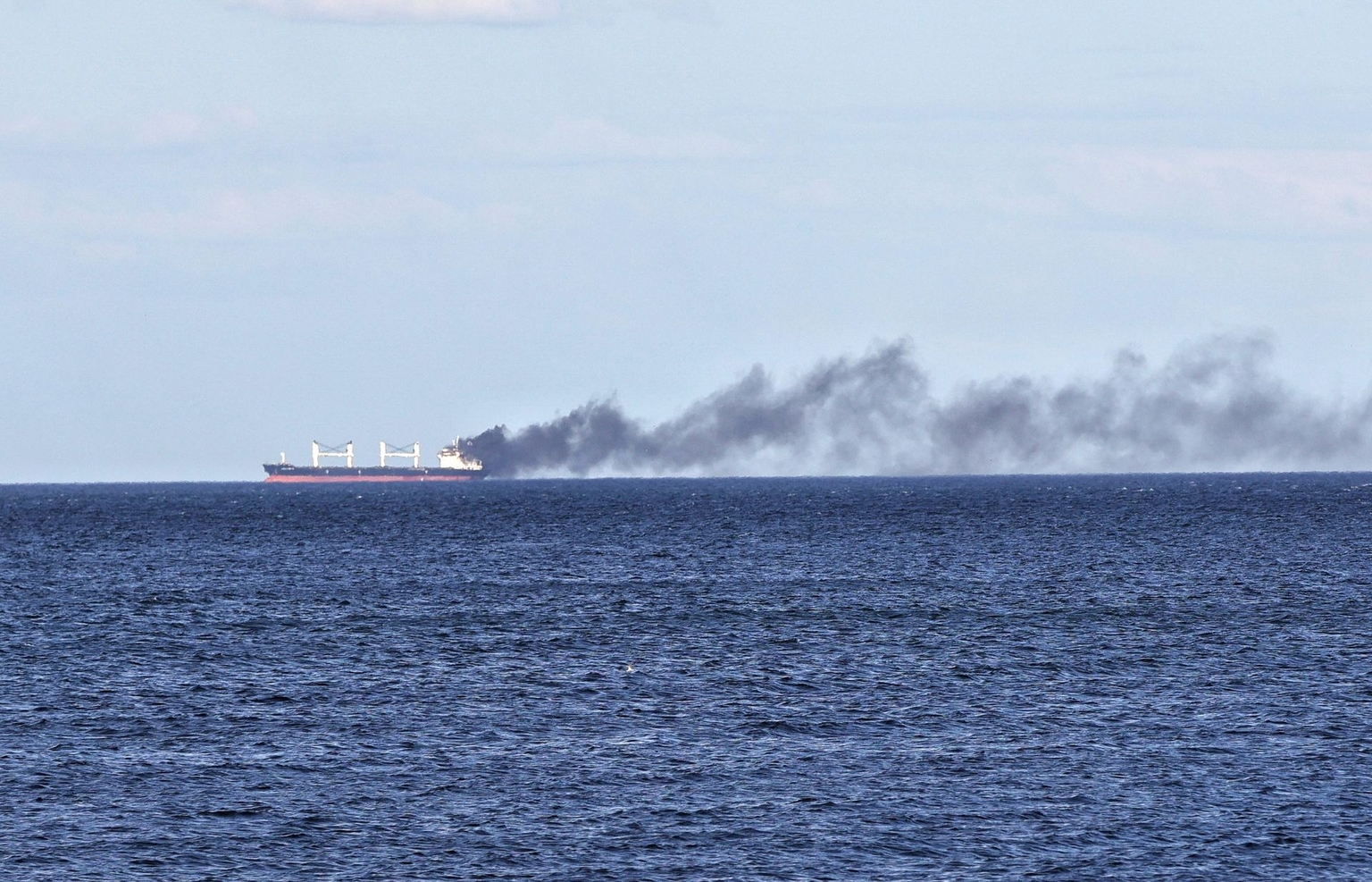 Black smoke rises from a vessel damaged by a Russian attack in the Black Sea off Odesa Oblast, Ukraine, on July 28, 2026.