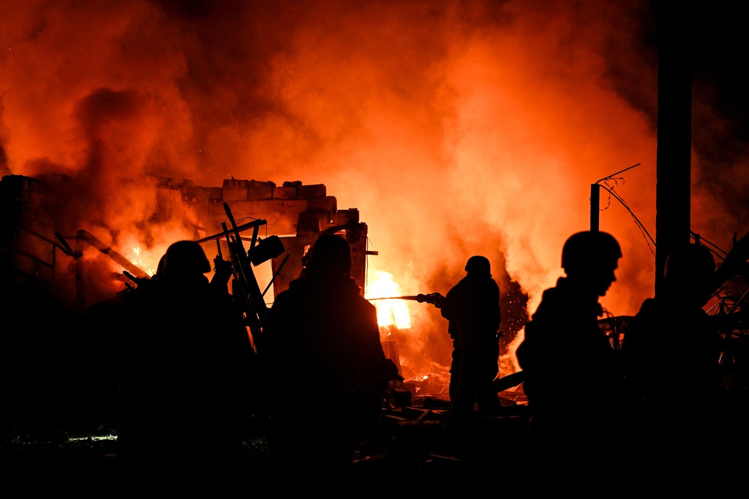 State Emergency Service rescuers extinguish a fire following a Russian strike on Zaporizhzhia, Ukraine, on Aug. 11, 2026.
