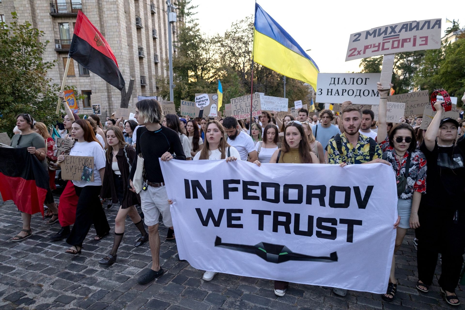 Protesters carry placards during a rally in central Kyiv, Ukraine, on August 16, 2026.