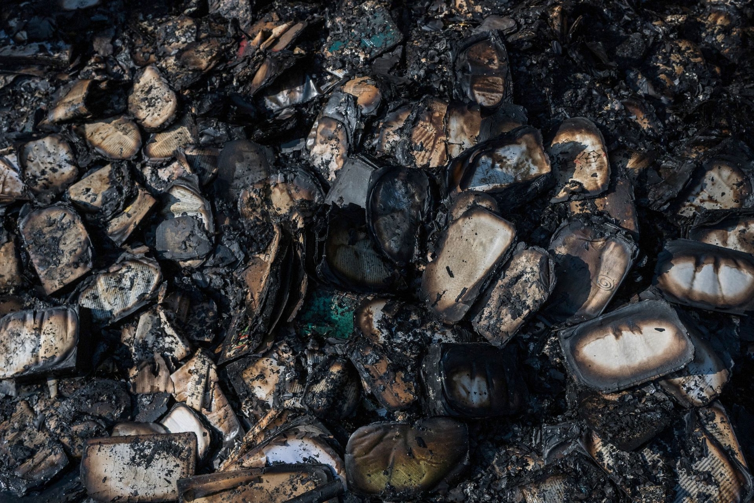 Burned books are seen following a fire at Ukraine's largest book market, caused by a Russian ballistic missile attack on Kyiv, Ukraine, overnight on Aug. 16, 2026.