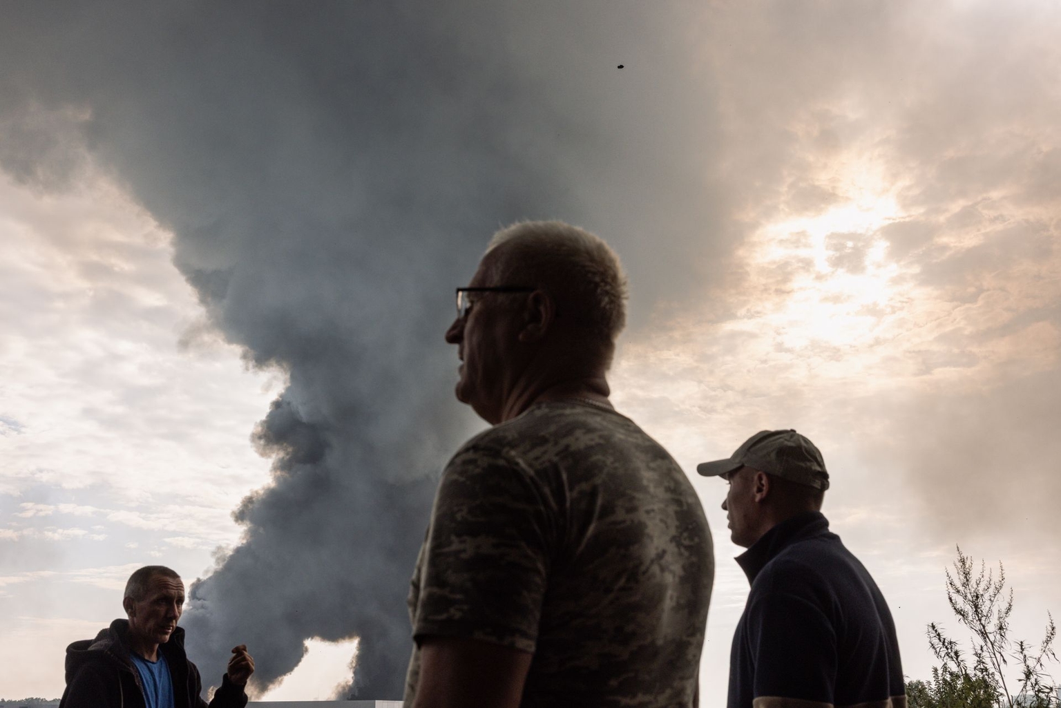 Residents gather at the scene of a Russian drone attack in Kyiv Oblast, Ukraine, on Aug. 27, 2026.