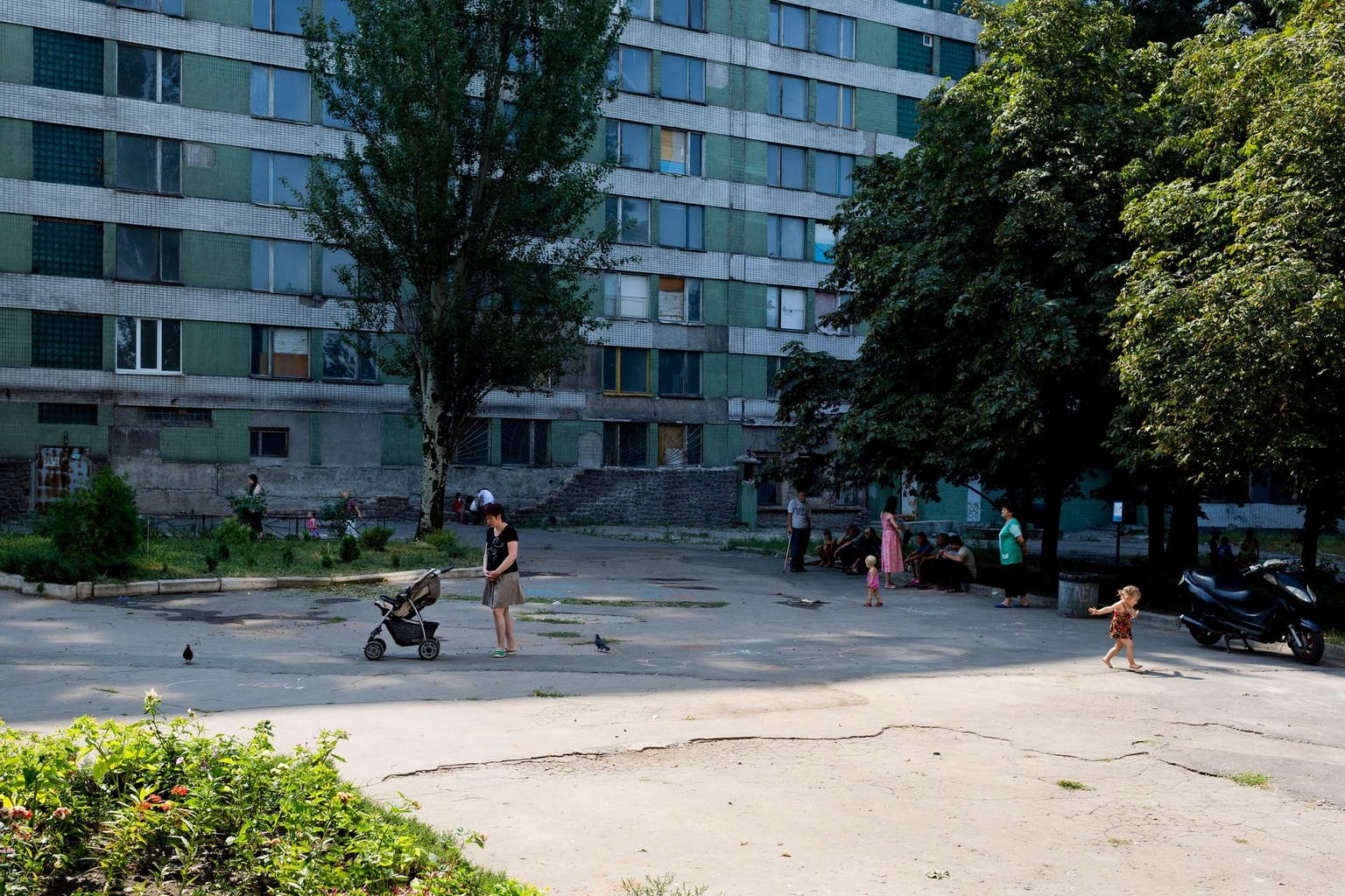 Donetsk residents near a building of the National University of Donetsk in Donetsk, Ukraine, on Aug. 12, 2014.