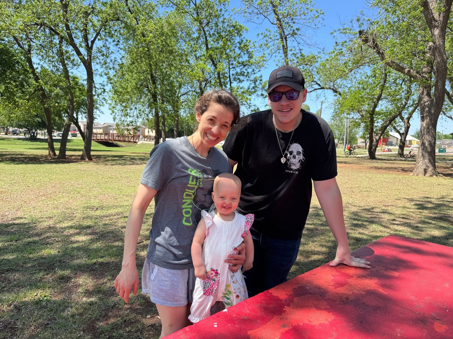 Amariah and Iris pose with Shane Tackett's brother, Chad Tackett, in an undated photo.