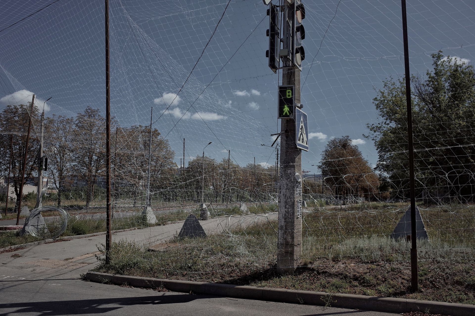Anti-FPV nets cover roads in Kramatorsk, Ukraine, on August 16, 2026.