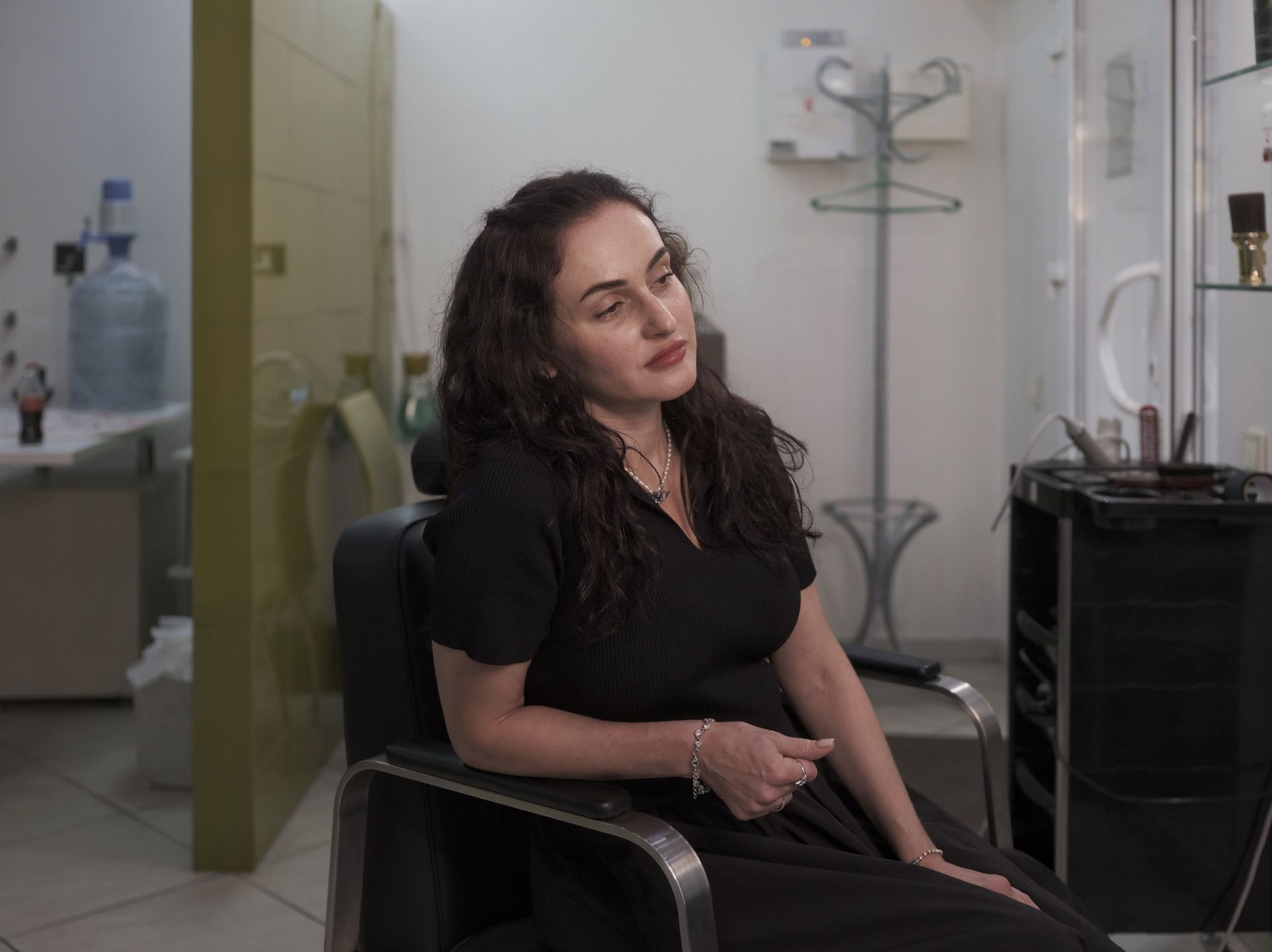 Anna Zaytseva from Kostiantynivka works at a barbershop in Kramatorsk, Ukraine, on August 17, 2026.