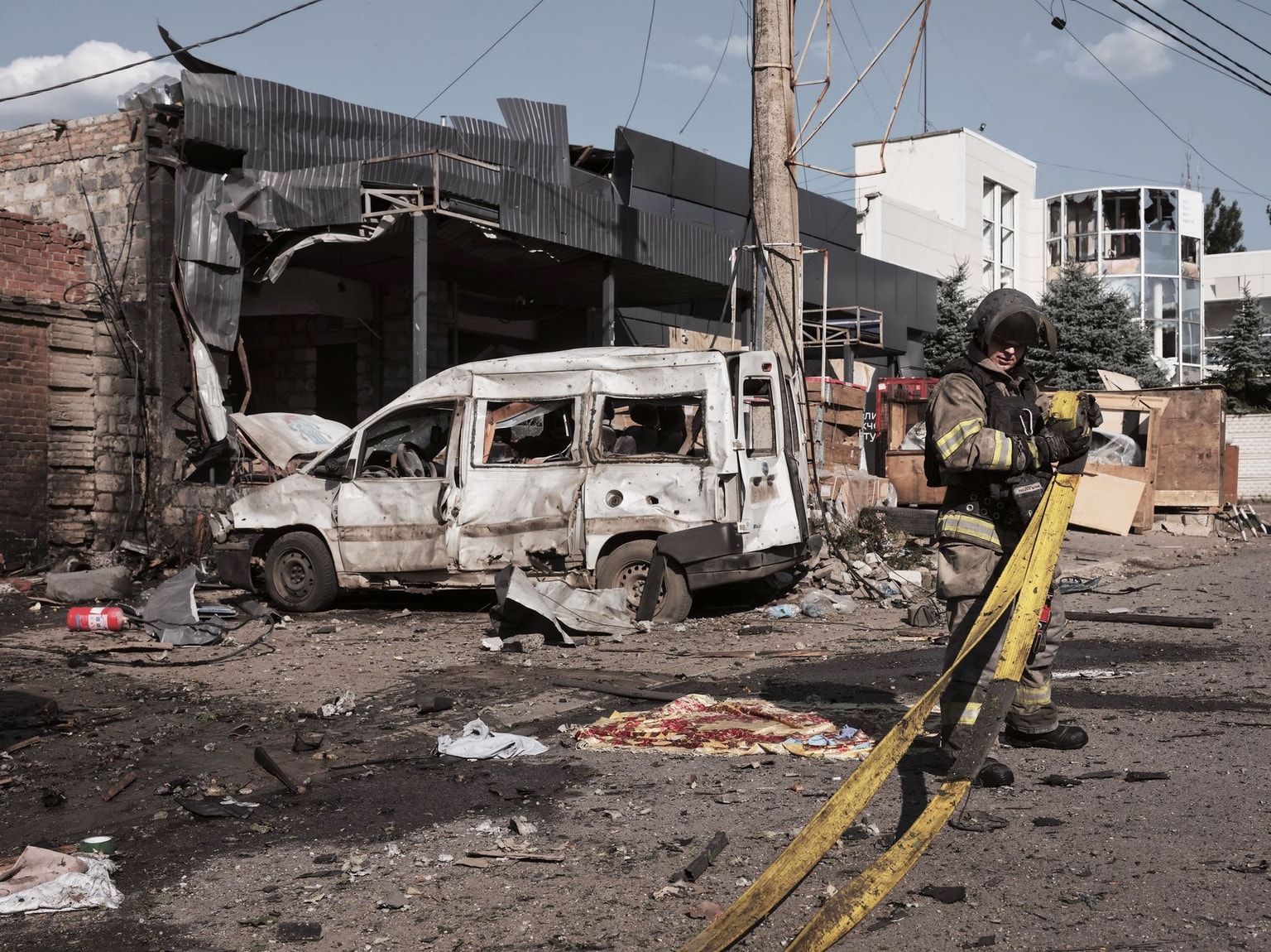 A rescuer deals with the aftermath of a Russian attack in Kramatorsk, Ukraine, on August 16, 2026.