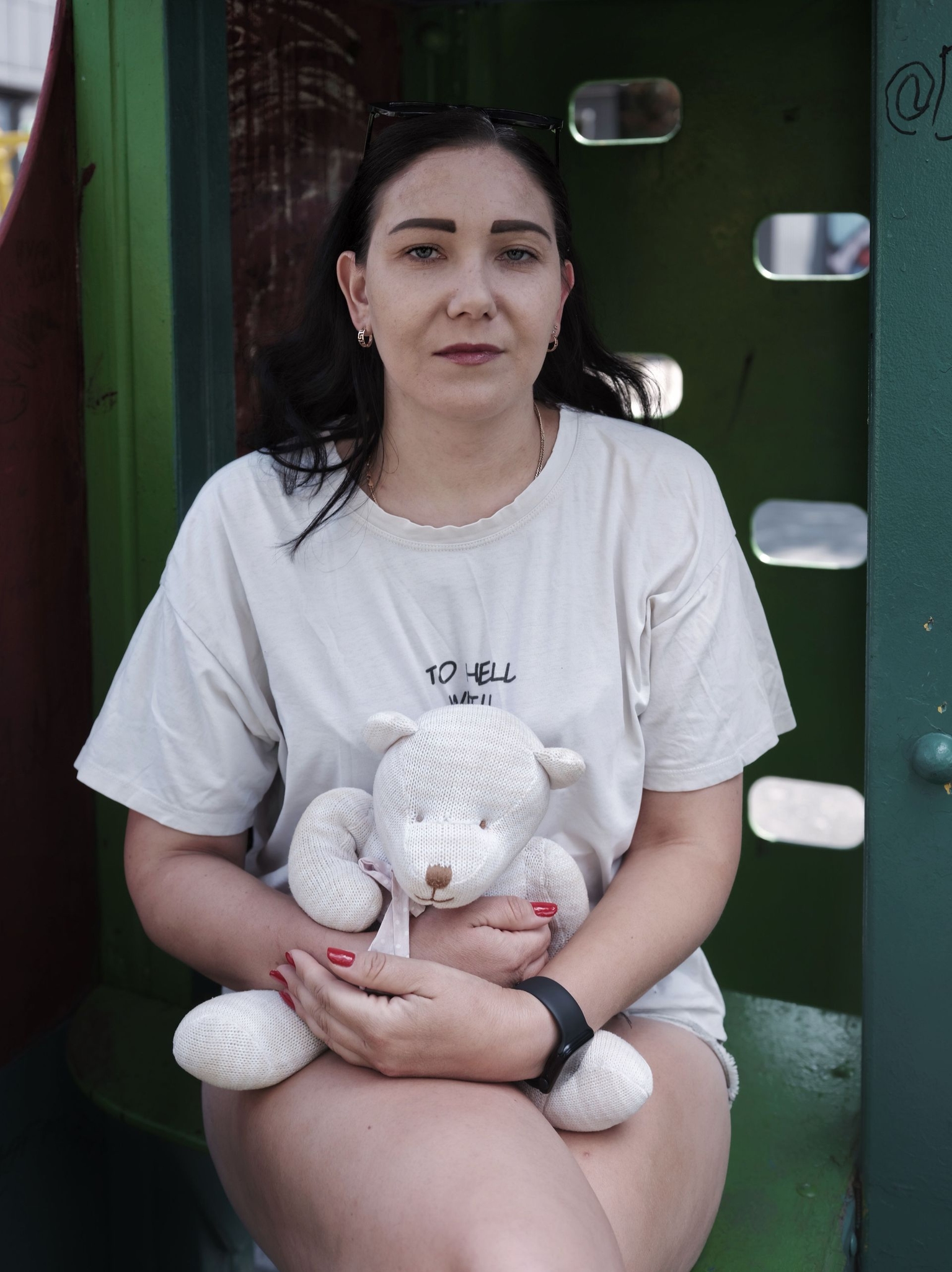 Inna Dashevska holds her child's toy at a playground in Pavlohrad, Ukraine, on August 15, 2026.