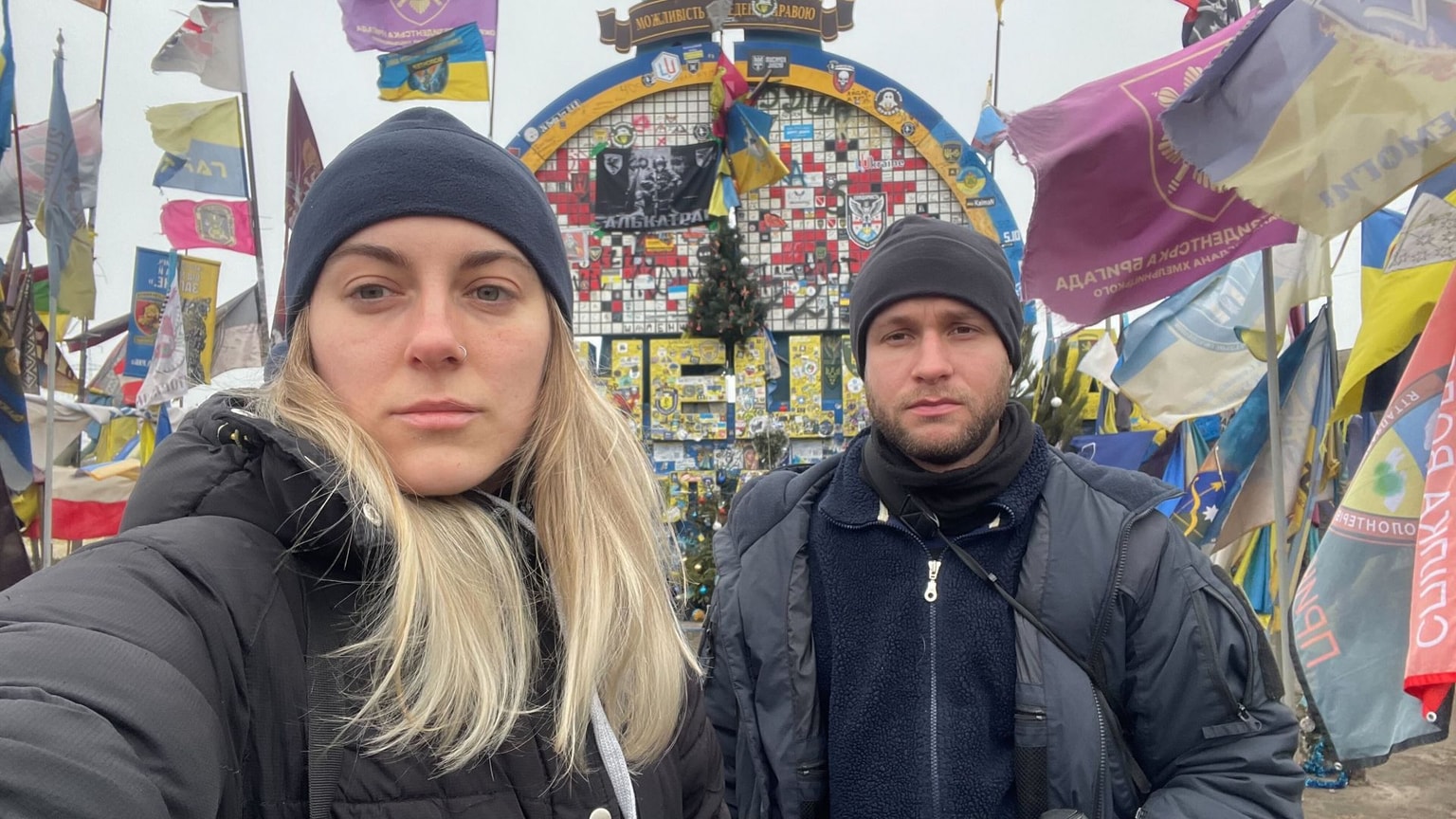 The Kyiv Independent war reporters near the iconic Donetsk stela (Olena Zashko/The Kyiv Independent)