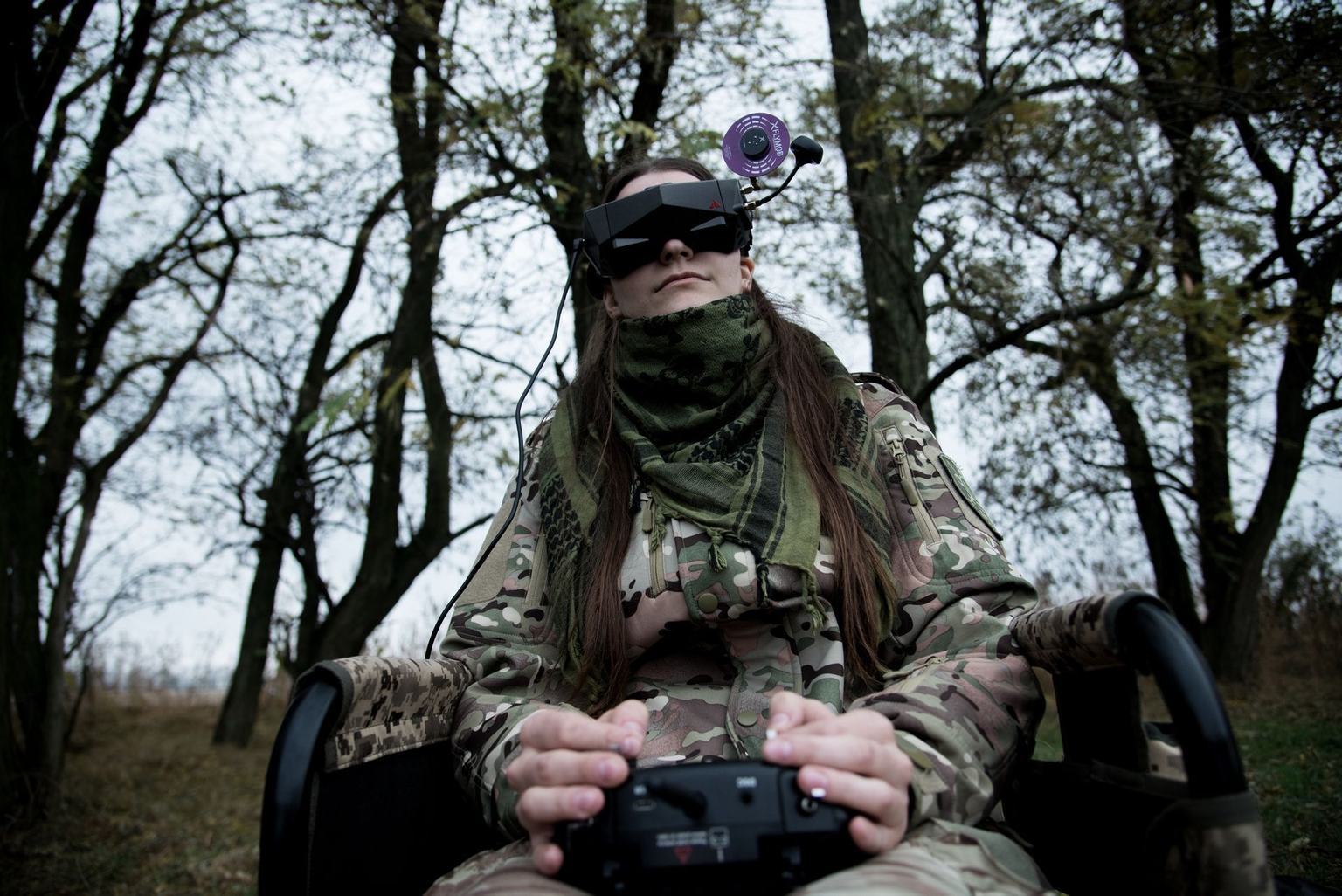 A military woman studies FPV drone control during training at a drone school in Zaporizhzhia Oblast, Ukraine, on Oct. 26, 2023.