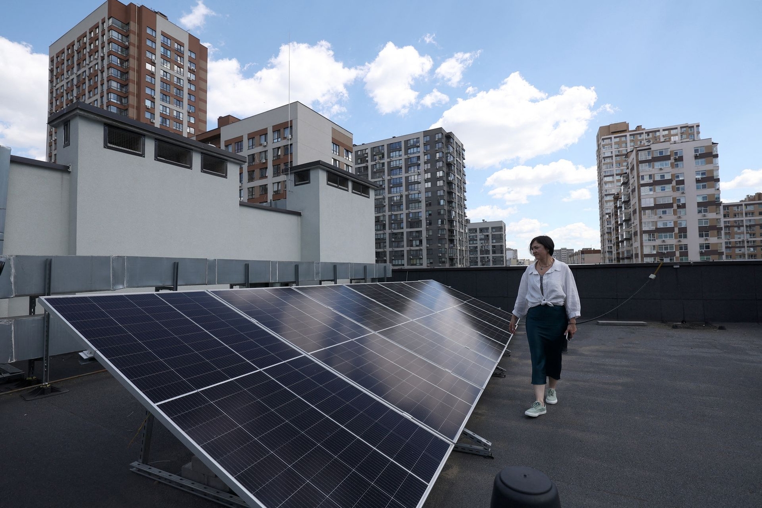 Solar panels on the school's roof during a power outage in Kyiv, Ukraine, on June 18, 2024Anastasia Kireeva-Kislynska, founder of the private school "Spilno School," demonstrates solar panels on the school's roof during a power outage in Kyiv, Ukraine, on June 18, 2024