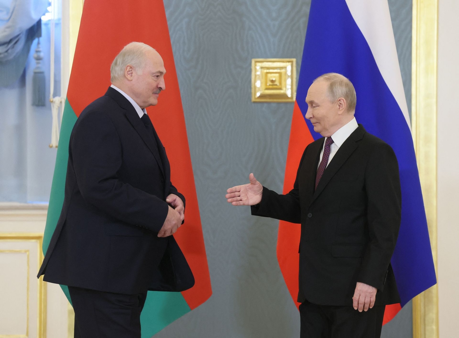 Russian President Vladimir Putin (R) greets Belarusian President Alexander Lukashenko (L) in Moscow, Russia, on Feb. 26, 2026.
