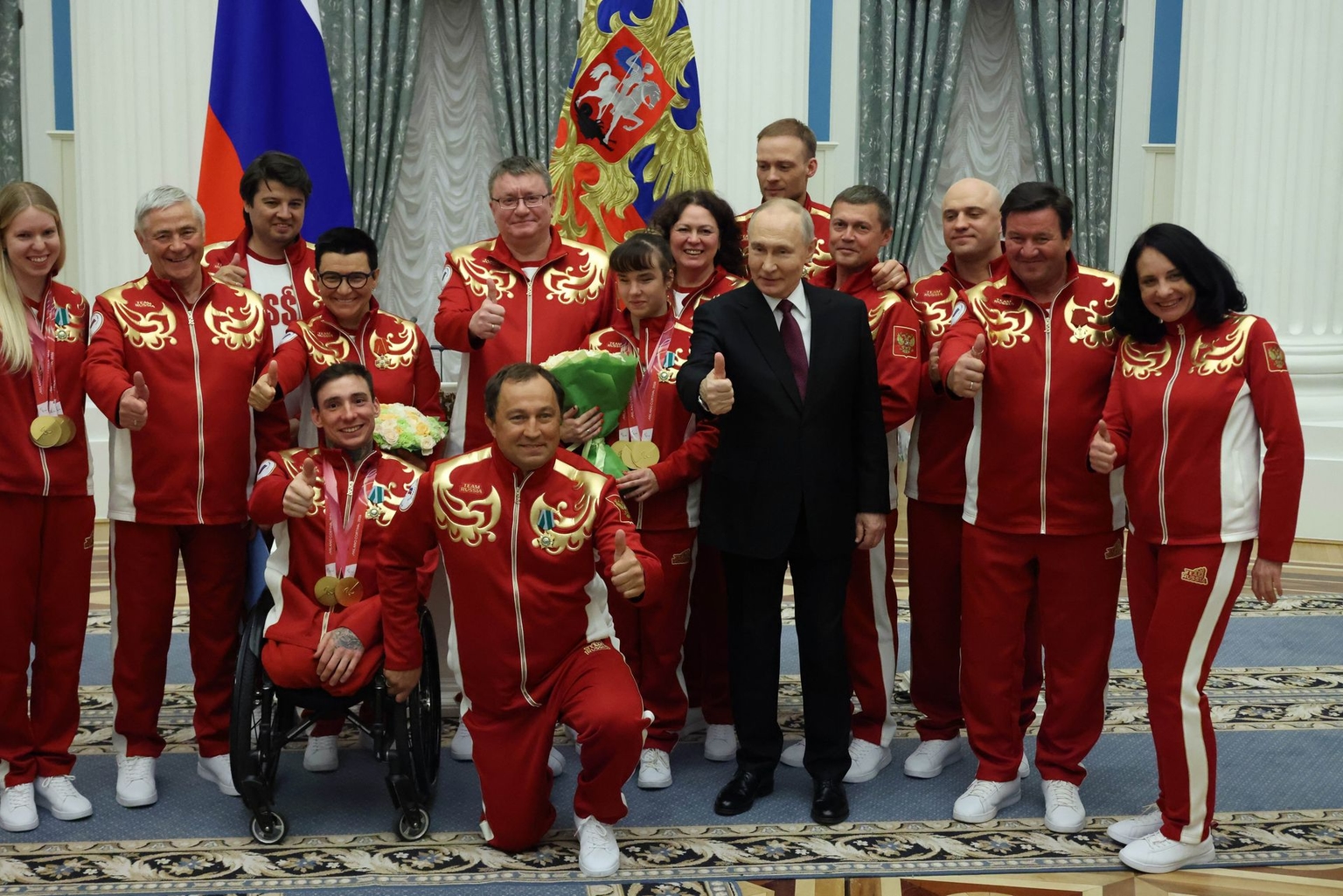 Putin poses with para athletes at an awards ceremony in Moscow, Russia, on March 19, 2026.