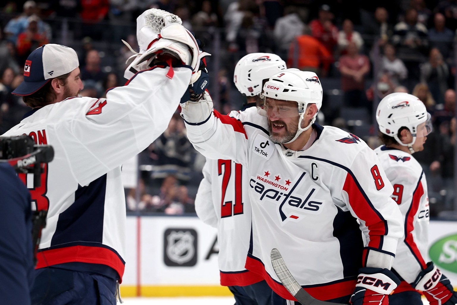 Alex Ovechkin high-fives Tom Wilson after a game in Columbus, Ohio, on April 14, 2026.