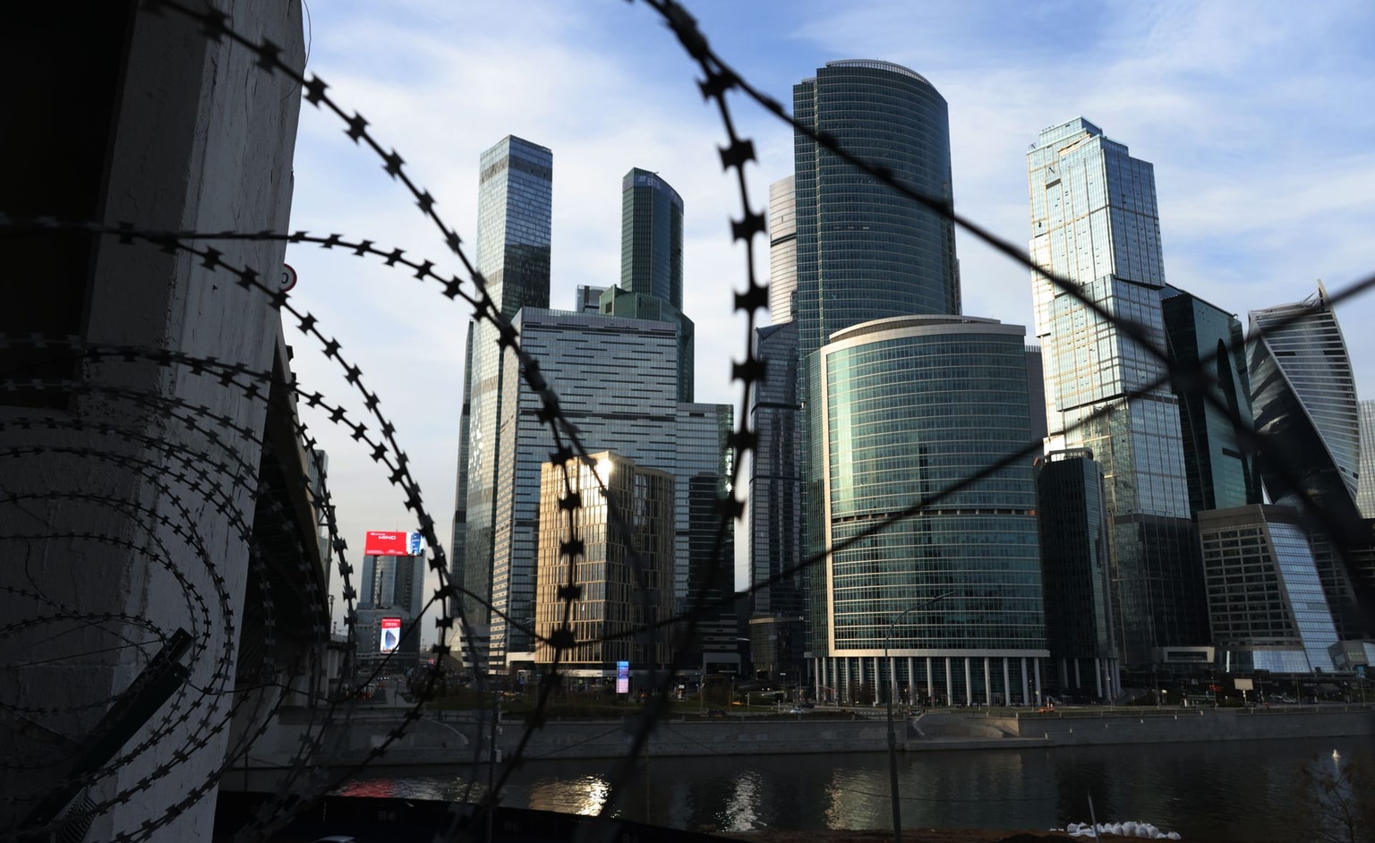Moscow City skyscrapers are seen through barbed wire in Moscow, Russia, on April 25, 2026.