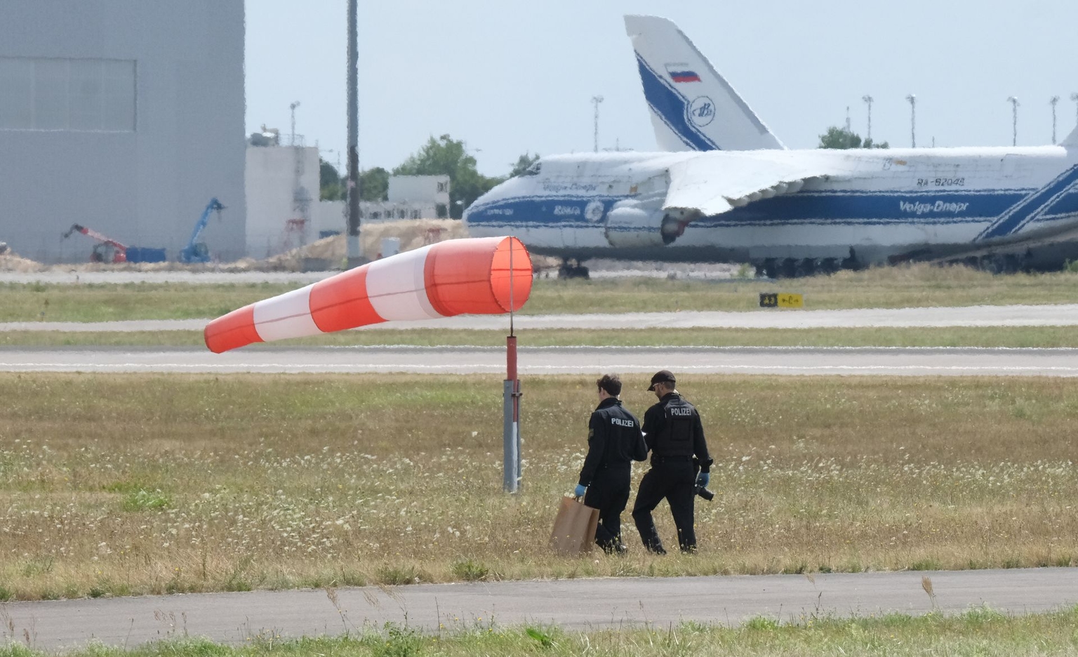 Police officers search a field near the northern runway of Leipzig-Halle Airport in Schkeuditz, Saxony, Germany, on Aug. 7, 2026.