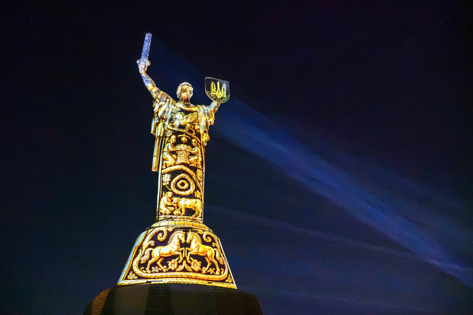 Light installation is projected onto the Mother Ukraine Monument in Kyiv on August 20, 2026.
