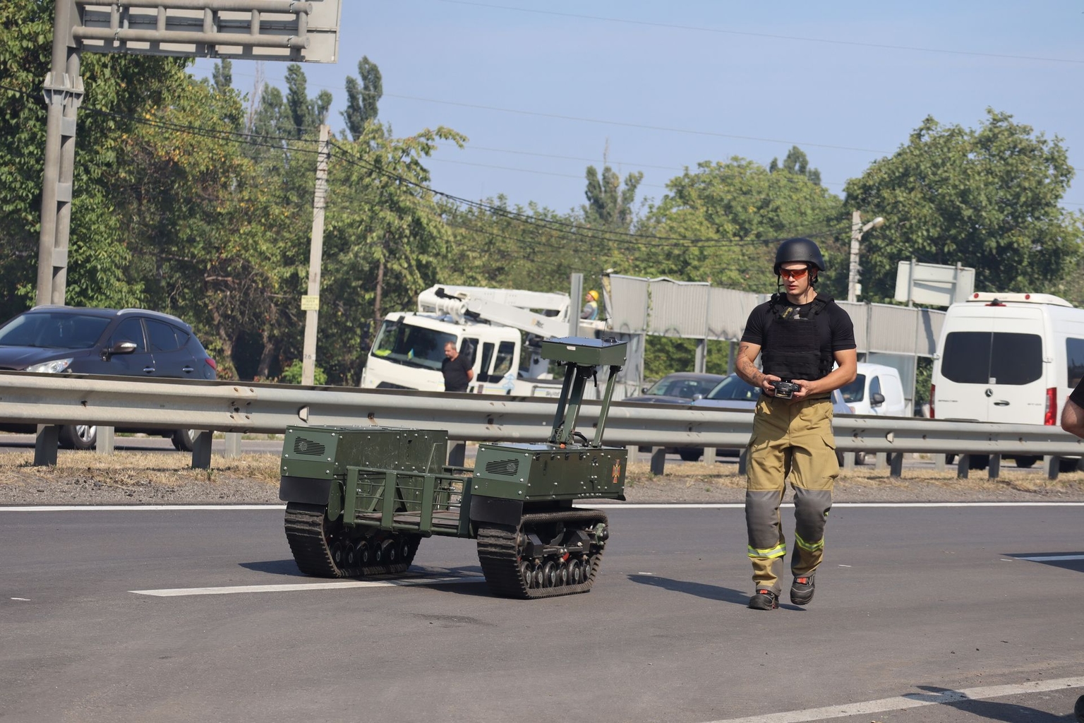 A rescuer controls an unmanned ground vehicle after a Russian drone attack in Myla, Ukraine, on August 29, 2026.