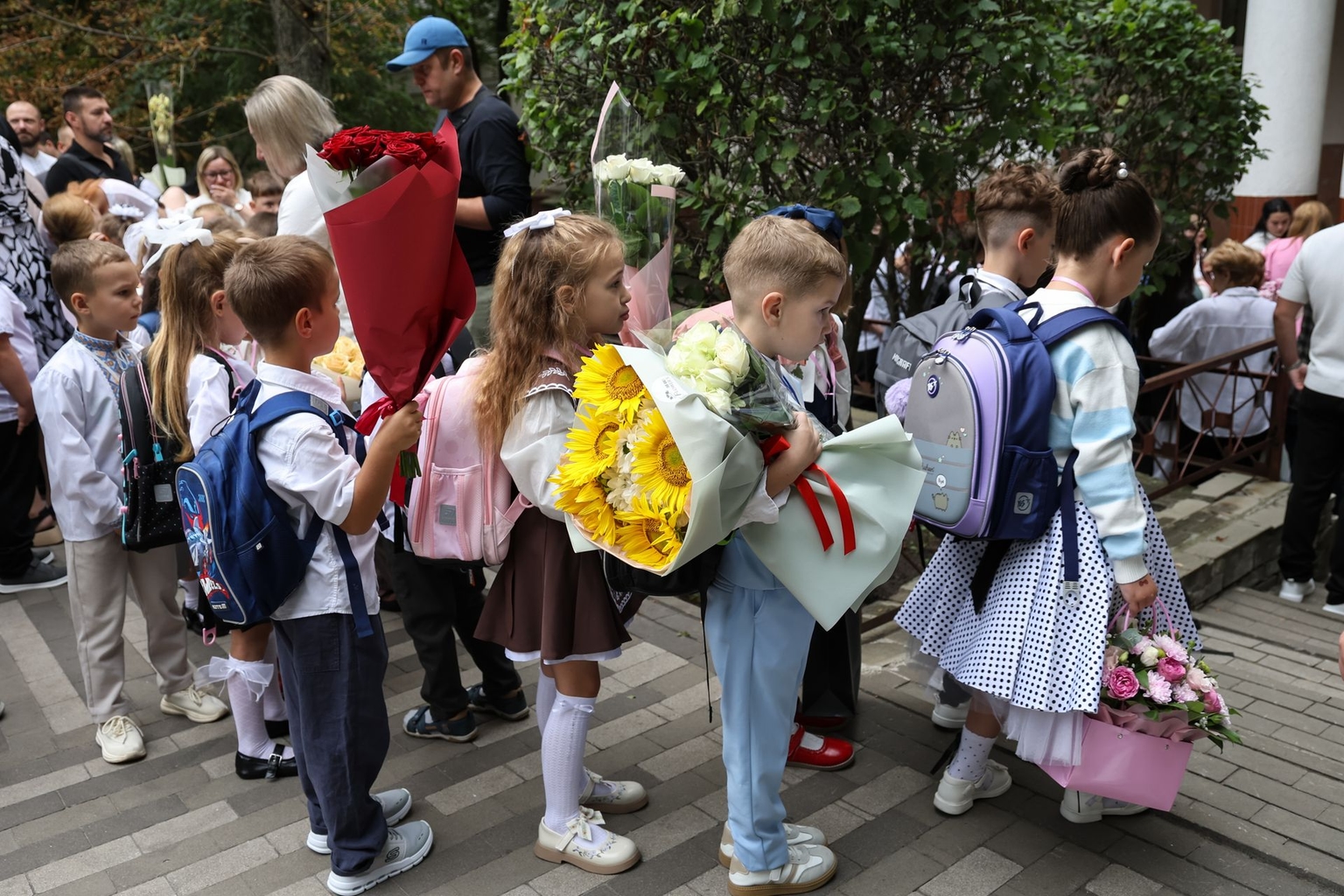 Children walk to school during a celebration marking the start of the school year in Kyiv, Ukraine, on Sept. 1, 2026
