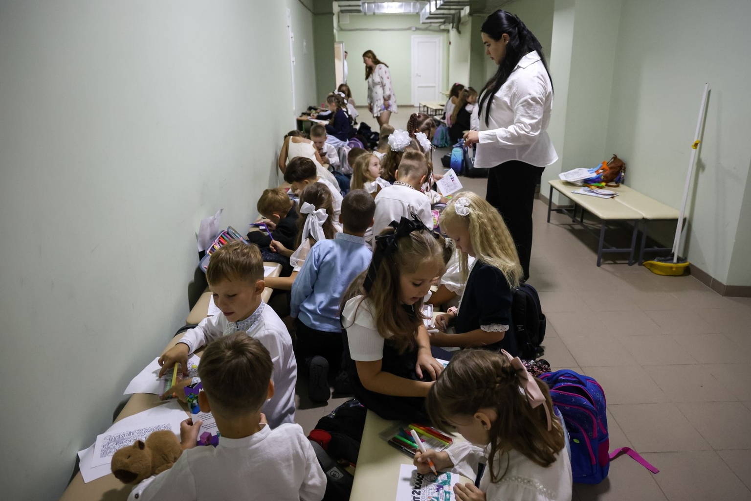 Children sit in a shelter during a celebration marking the start of the school year in Kyiv, Ukraine, on Sept. 1, 2026.